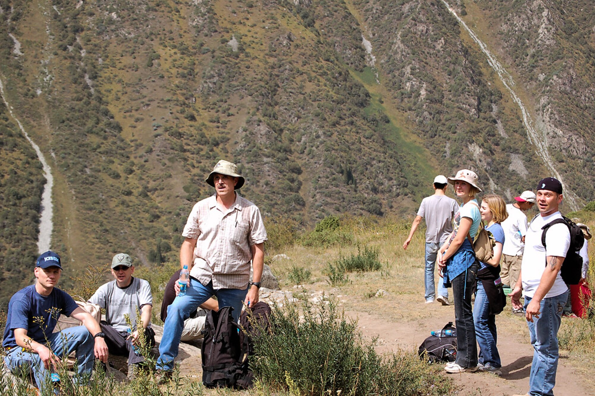 Manas servicemembers take a breather during a hike through Kyrgyzstan's Ala Archa Gorge and National Park. Deployed servicemembers to Manas have a unique opportunity through the base International Tours and Travel office to frequent more than 40 locations ranging from hiking, horseback and dining trips throughout Kyrgyzstan and the city of Bishkek. (U.S. Air Force photo/Maj. Damien Pickart)
