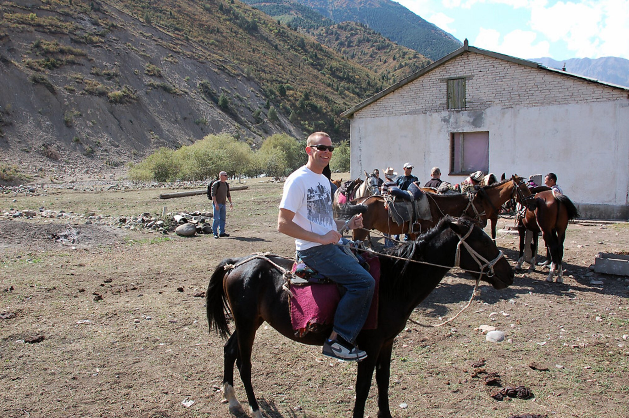 Servicemembers saddle up for a horseback riding trip in the mountains of Kyrgyzstan. The trip was offered by the base International Tours and Travel office. Deployed servicemembers to Manas have an unique opportunity through the base ITT office to frequent more than 40 locations ranging from hiking, horseback and dining trips throughout city of Bishkek and the country. (U.S. Air Force photo/Maj. Damien Pickart)