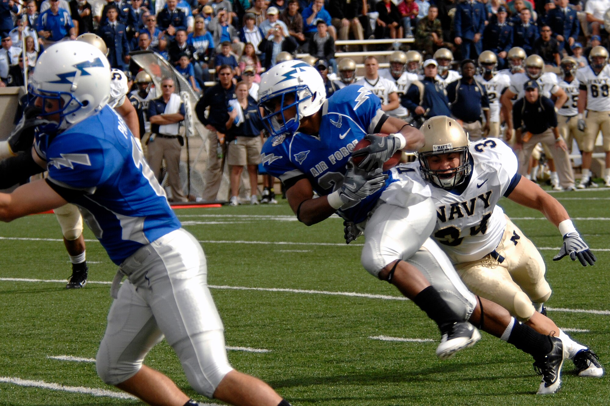 U.S. Air Force Academy sophomore running back Kyle Lumpkin eludes a tackle as Navy defeated Air Force 33-27 at the Academy in Colorado Oct. 4. (U.S. Air Force photo/Rachel Boettcher)