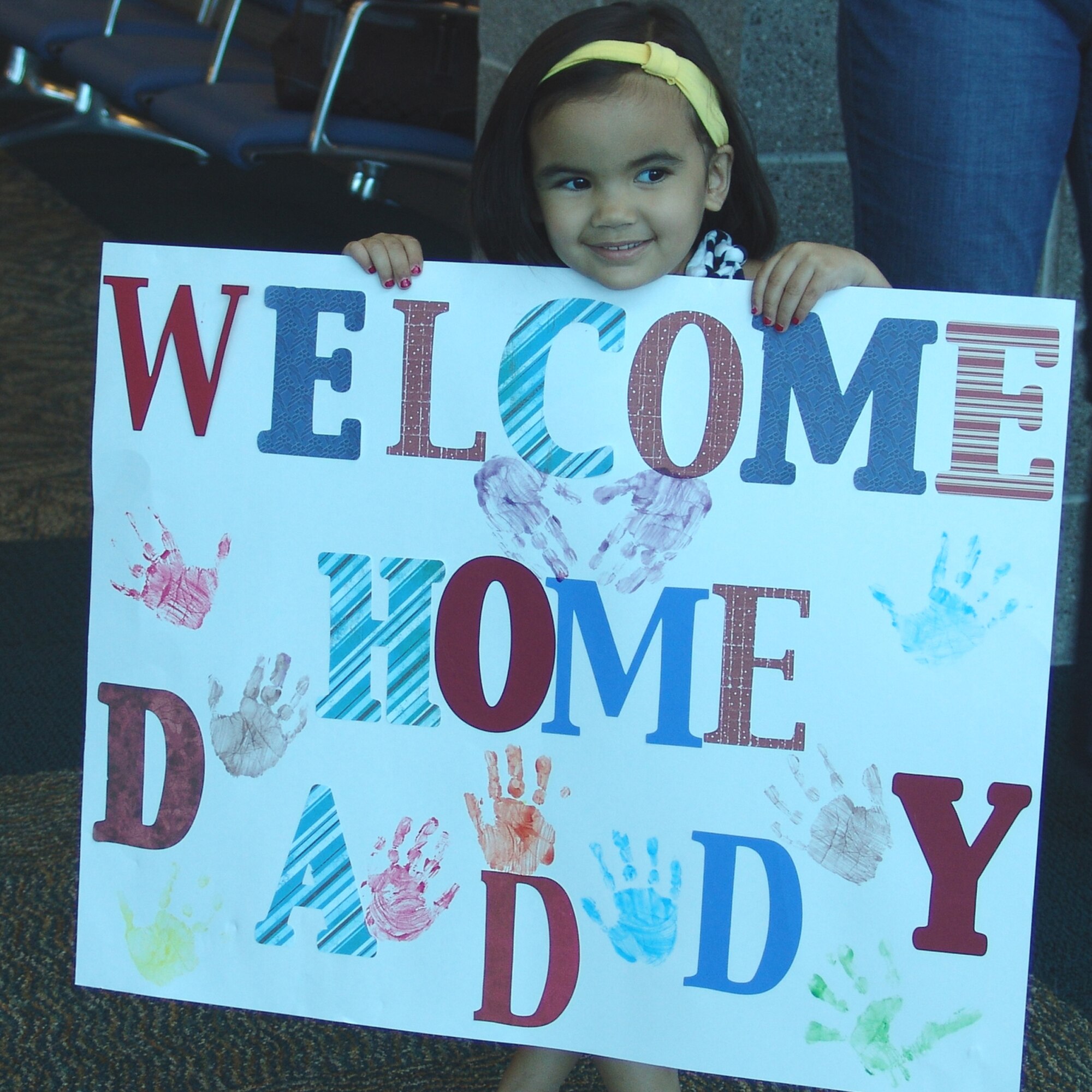 A little girl waits for her father's arrival after being deployed for six months with the 96th Security Forces Squadron. She is the daughter of Staff Sgt. Devin Skillman. (USAF photo by Lois Walsh)