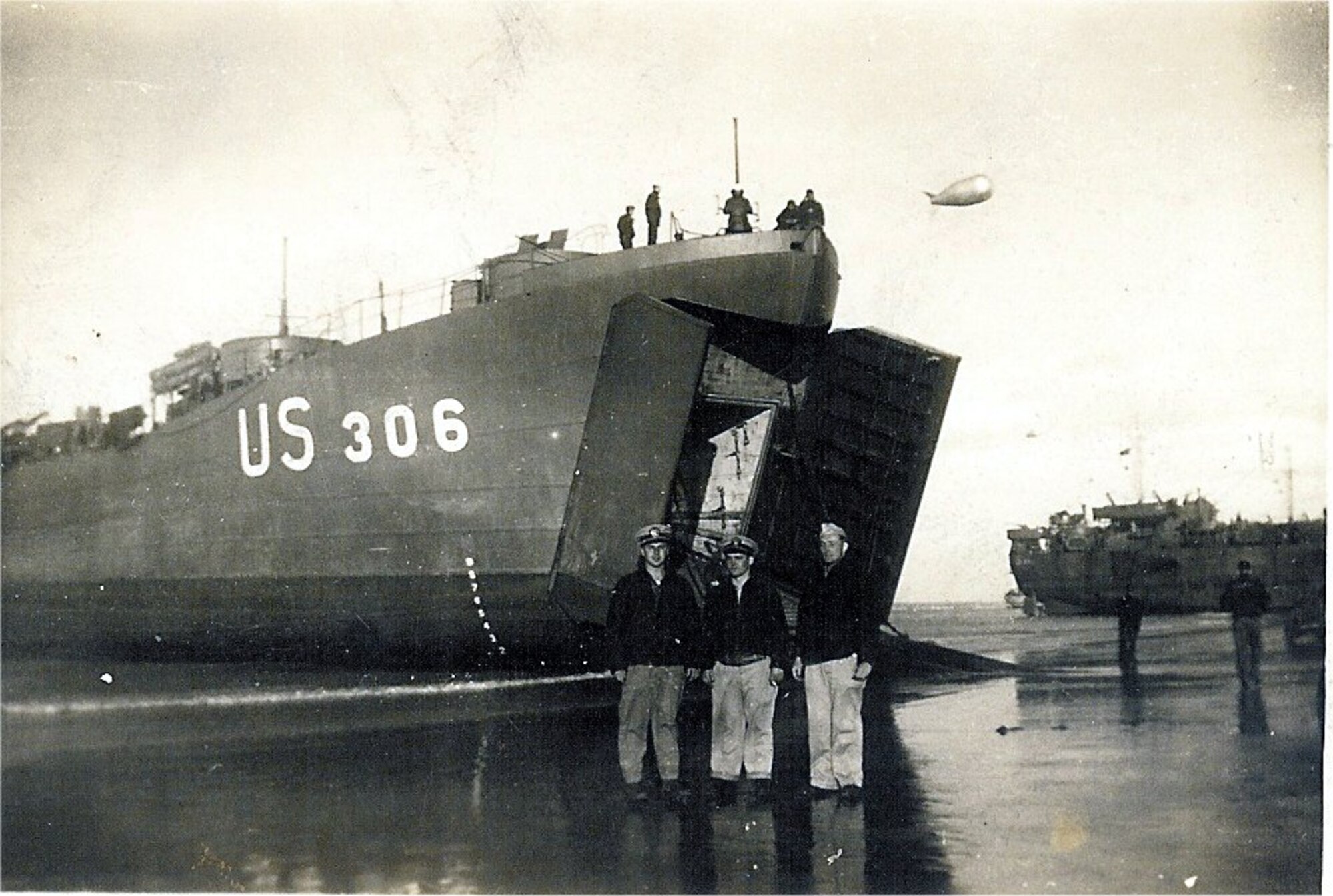 Landing Ship, Tank 306 (LST-306) shortly after she landed on Utah beach on 6 June 1944 during the invasion of Normandy.  It was on this ship that now retired Chief Radioman Joe Pearson took his first trip to this beach under fire on D-Day.  The Chief, who now lives in England near RAF Molesworth, returned in far more pleasant circumstances on September 27, 2008 as an honored participant in the dedication of the U.S. Navy Memorial to the landing. (U.S. Navy archive photo)