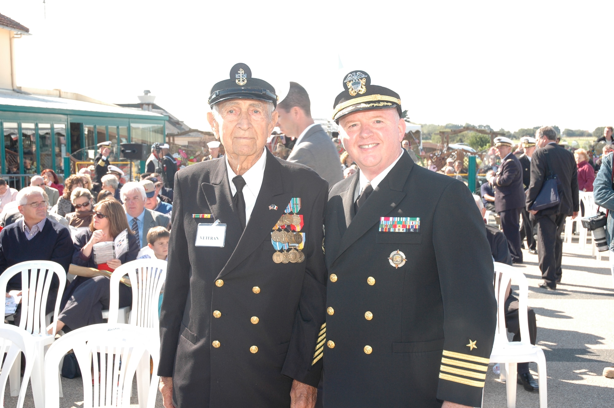Navy Captain Henry J. "Harry" Babin, Deputy Commander of the JIOCEUR Analytic Center at RAF Molesworth, England stands with D-Day veteran Chief Radioman Joe Pearson at the dedication the U.S. Navy Memorial at Utah Beach on September 27, 2008.  This was Chief Pearson's second visit to this stretch of sand - his first was under fire on D-Day 1944. Chief Peterson lived near RAF Molesworth and until he passed away recently was an inspiration to generations of JAC sailors.  (Photo courtesy of Chief Petty Officer Steven L. Schultz)