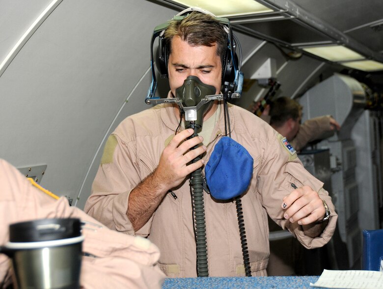 SOUTHWEST ASIA -- Flight Lt. Troy Roempke from the 965th Expeditionary Airborne Air Control Squadron checks his equipment before going on a mission in support of the global war on terrorism here Oct. 4. Flight Lt. Roempke is from the Australian Air Force and is here on an exchange program allowing coalition forces to learn from each other both in their respective countries and in a deployed operational environment. The unit is currently deployed from Tinker Air Force Base, Okla. (U.S. Air Force photo/Tech. Sgt. Christopher A. Campbell)(released)
