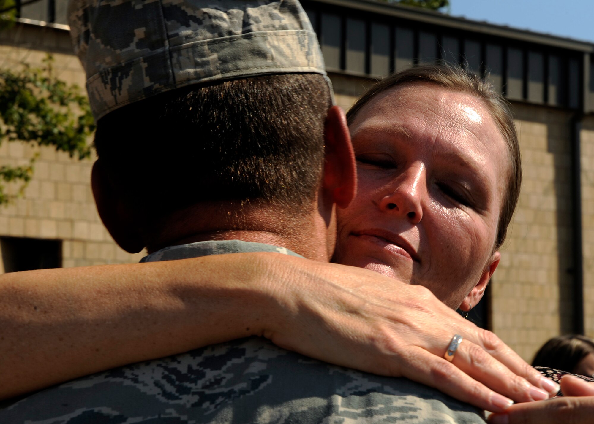 MOODY AIR FORCE BASE, Ga. -- A woman hugs a loved one of the 822nd Security Forces Squadron during a welcome home ceremony here Oct. 4. The 822nd SFS were greeted by family members, friends and loved ones after retuning from a deployment to Iraq. (U.S. Air Force photo by Senior Airman Brittany Barker)

