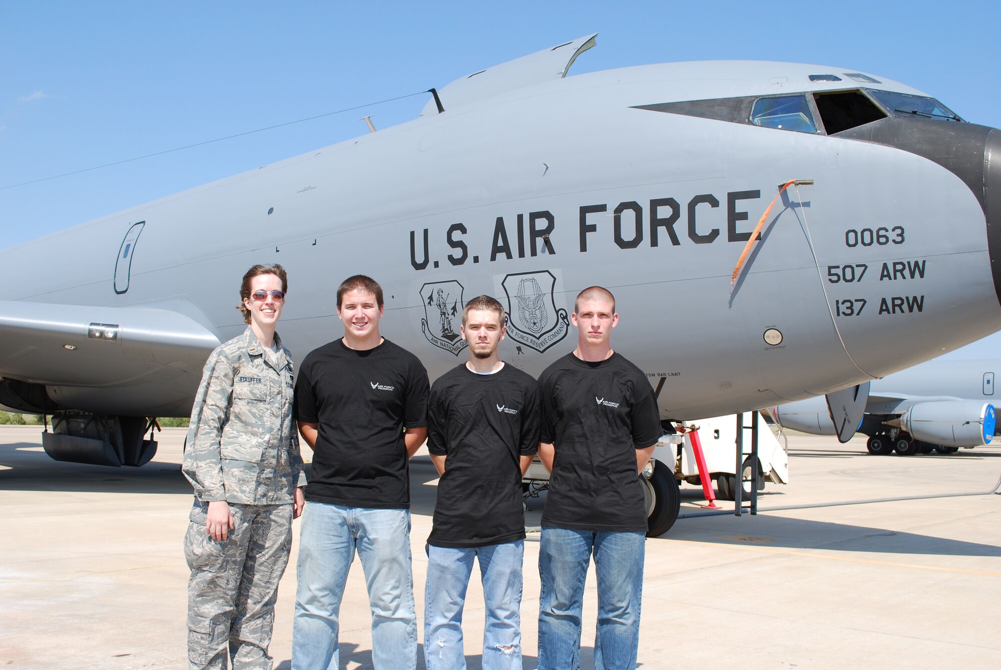 2nd Lt. Jacquelyn Stauffer, meets up with three new recruits destined for her section immediately before a mass enlistment ceremony is held in front of a KC-135R here at Tinker Air Force Base October 5.  The lieutenant is the Transportation Flight officer with the 507th Air Refueling Wing's Logistics Readiness Squadron. Pictured with her (left to right) is John Melton, who will be assigned to vehicle operations, Zack Setzer, vehicle maintenance and Dustin Payne, who will be assigned to the Logistics Plans section.  In all, 25 new recruits were sworn into the Air Force Reserve Command.  These new recruits will now head off for basic training and technical school.