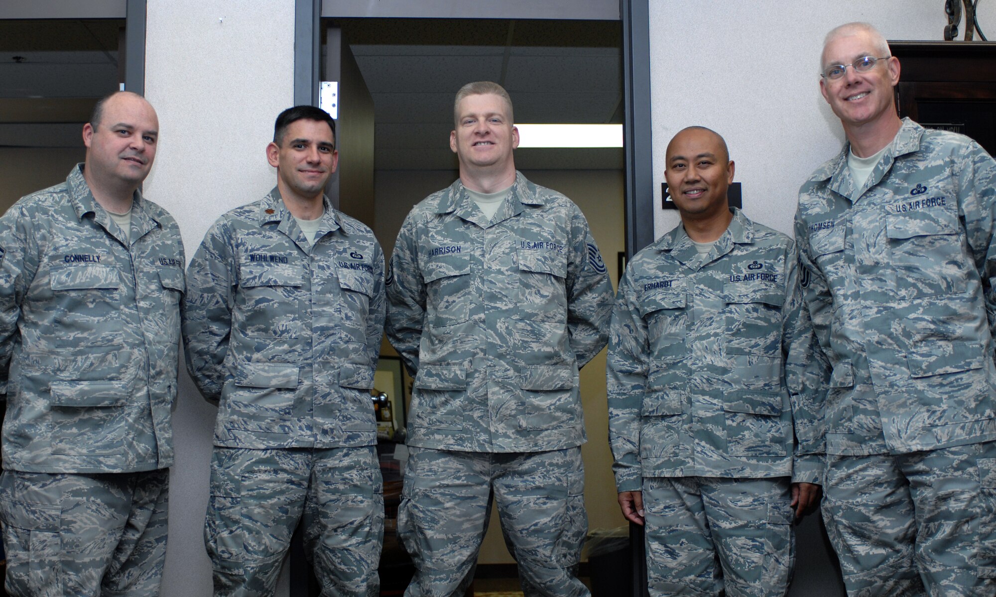 Tech. Sgt. John Harrison, 49th Operations Support Squadron, poses with members of his squadron at Holloman Air Force Base, N.M., September 26 upon his return from a four-month deployment to Iraq. While deployed, Sergeant Harrison worked the same duty he works while state-side, weather forecasting. From left to right: Master Sgt. Paul Connelly, Maj. Christian Wohlwend, Tech. Sgt. John Harrison,  Master Sgt. Carlo Erhardt and Senior Master Sgt. Scott Thomsen, all from the 49 OSS. (U.S. Air Force photo/Airman Sondra M. Escutia)