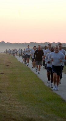 MOODY AIR FORCE BASE, Ga. – Airmen head towards the finish line during the violence prevention month five-kilometer run/walk here Oct. 3. The course led Airmen from the gym, past the flightline, and back to complete the run. (U.S. Air Force photo by Airman Joshua A. Green/RELEASED) 