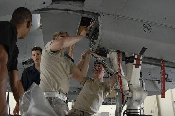 MOODY AIR FORCE BASE, Ga. -- Airmen of the 23rd Equipment Maintenance Squadron make preparations to inspect for cracks within the wing frame of a A-10C Thunderbolt II model here Oct.4. After identifying structural cracks on thin skinned A-10s and A-10C Thunderbolt II models the Air Force has issued a systematic identification of certain affected airframes by corresponding tail number.  The inspection is necessary for the safety of aircrews and to bring our aging A-10 fleet back to health.  The A-10 is a valuable asset to joint warfighters because of its unique capabilities to deliver precision-guided weapons at high altitudes and provide low altitude close air support. (U.S. Air Force Photo taken by SrA Javier Cruz) 