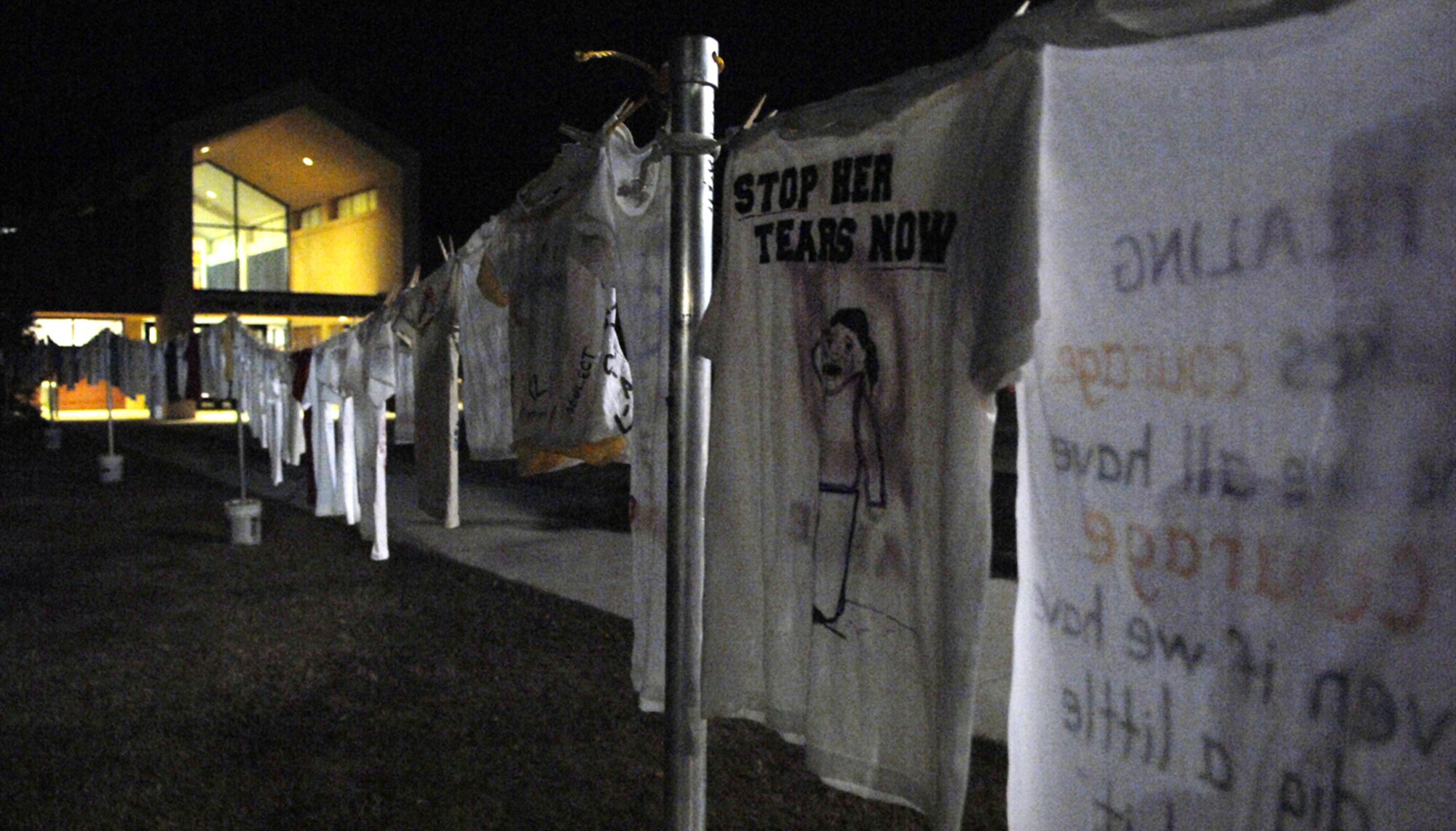 MOODY AIR FORCE BASE, Ga. – A shirt says “Stop Her Tears Now” here Oct. 3. Shirts from the clothes line display are all made by victims of past abuse and are used as a healing tool. (U.S. Air Force photo by Airman Joshua A. Green) 

