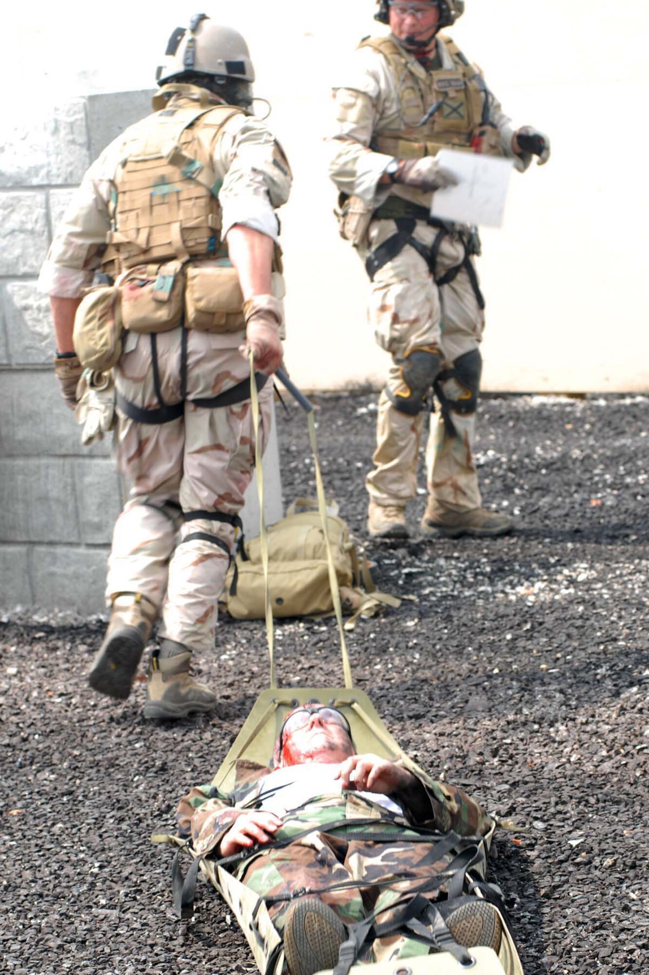 U.S. Air force photo of pararescuemen transporting a patient by litter during the Mass casualty exercise at the 2008 Para Rescue Rodeo hosted by the 123rd Special Tactics Squadron Kentucky Air National Guard. The rodeo consisted of Air Force, Air Force Reserve, Air National Guard and Canadian participants. During the weeklong event consisting of eight different teams they competed in five different areas. Mass casualty, Urban Tactical Personal Recovery, Confine Space, Rescue Jump Master, and the Canopy Accuracy event. The Main goal of the rodeo was competition, providing cross intelligence sharing and training in a simulated real life environment. (USAF Photo by MSgt Gerold O. Gamble) (released)