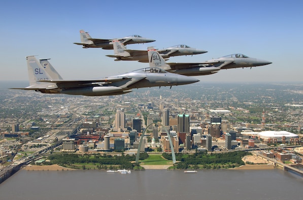 Lt. Col. Jim "Hacksaw" McComas, 110th Fighter Squadron pilot, Lt. Col. Darrin "Elvis" Barritt, 110th Fighter Squadron pilot, Lt. Col. Steve "2 Dogs" DeMilliano, 110th Fighter Squadron pilot, and Lt. Col. Reed "Snake" Drake, 110th Fighter Squadron pilot, fly their F-15 Eagles in a four-ship formation over St. Louis, Missouri Sept. 17.  The pilots were en route to conduct Aerial Combat Manuevers. (Photo by Capt. Timothy Reinhart)