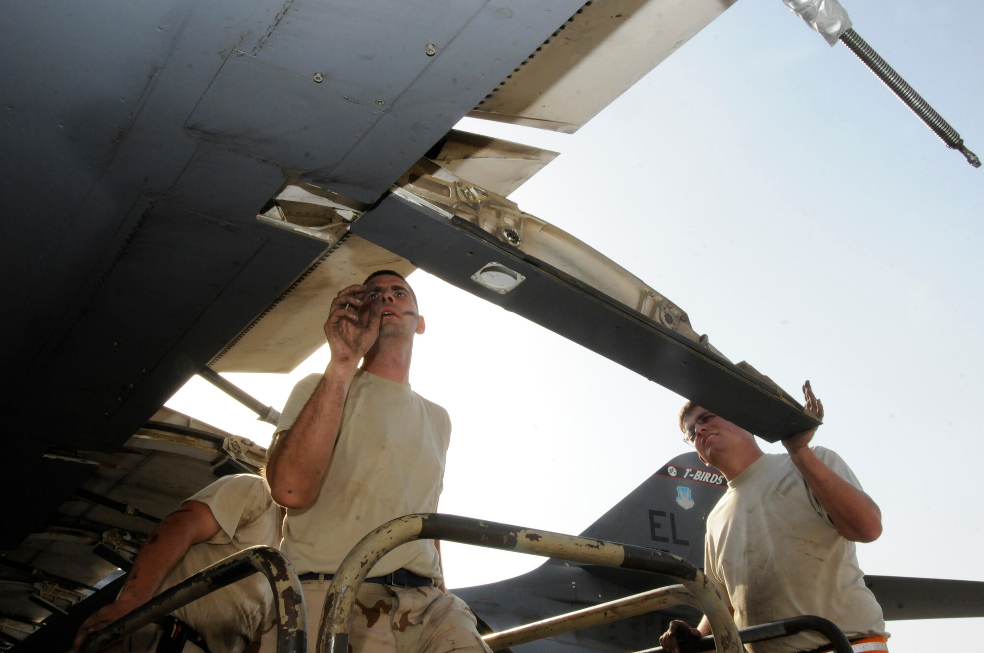 Tech. Sgt. Shaun Carroll and Tech. Sgt. Donald Brogan check movement in a B-1 Lancer flap carriage October 5, 2008.  The two, both assigned to the 379th Expeditionary Aircraft Maintenance Squadron, 34th Aircraft Maintenance Unit, are pulling the flaps in order to troubleshoot a flap lock-up problem at an undisclosed air base in Southwest Asia.  The B-1 is often called upon to deliver precision weapons in support of ground troops engaged in Operations Iraqi and Enduring Freedom.  Sergeant Brogan, a native of Saint Charles, Mo., and Sergeant Carroll, hailing from Charleston, S.C., are both deployed from Ellsworth Air Force Base, S.D.  (U.S. Air Force photo by Tech. Sgt. Michael Boquette/Released)