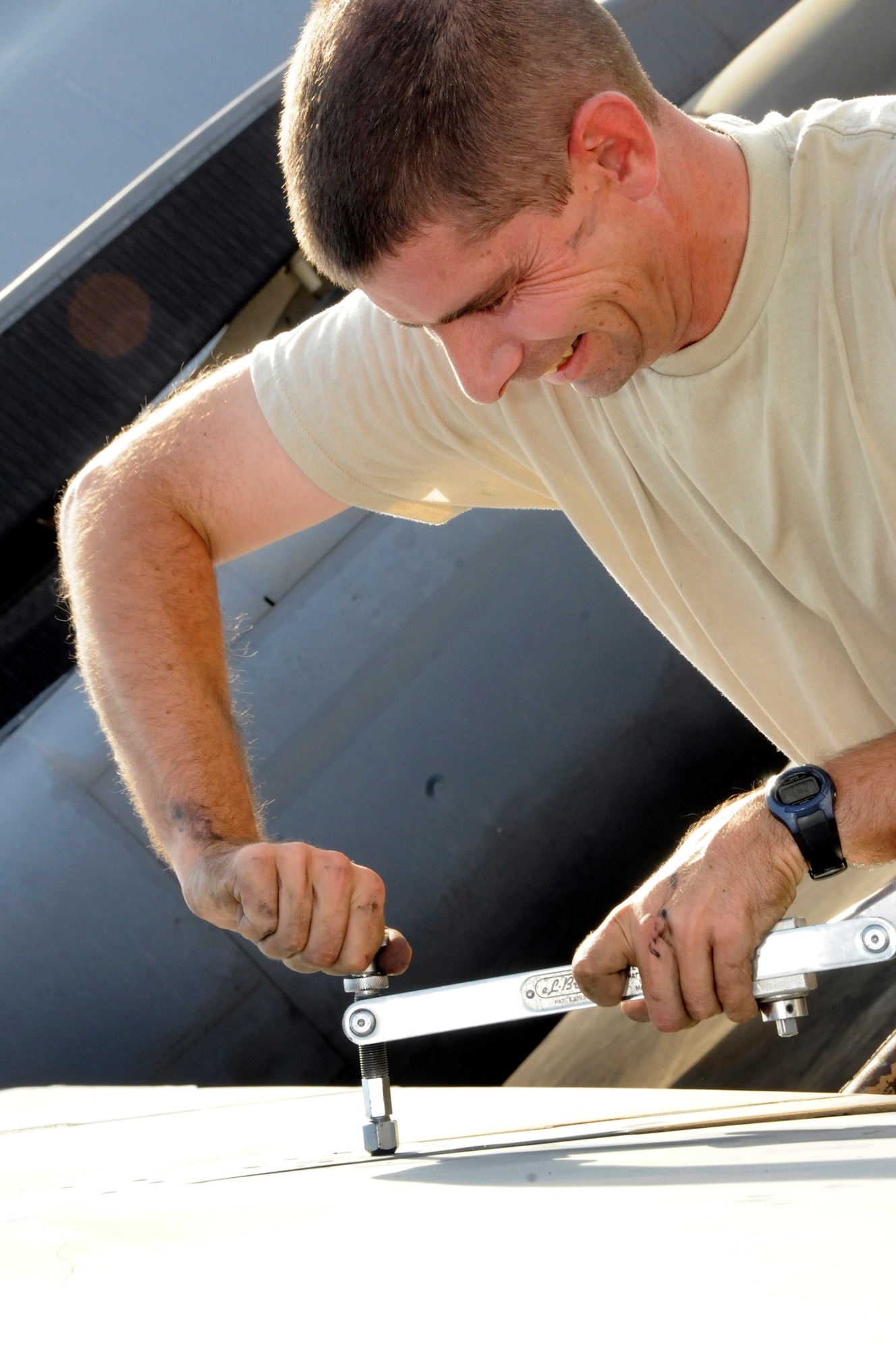 Tech. Sgt. Donald Brogan, 379th Expeditionary Aircraft Maintenance Squadron, 34th Aircraft Maintenance Unit, tightens a screw into a special wrench that is used for extra torque to remove screws from a B-1 Lancer flap October 5, 2008.  A maintenance crew is pulling the flaps from the B-1 Lancer in order to troubleshoot a flap lock-up problem at an undisclosed air base in Southwest Asia.  The B-1 is often called upon to deliver precision weapons in support of ground troops engaged in Operations Iraqi and Enduring Freedom.  Sergeant Brogan, a native of Saint Charles, Mo., is deployed from Ellsworth Air Force Base, S.D.  (U.S. Air Force photo by Tech. Sgt. Michael Boquette/Released)