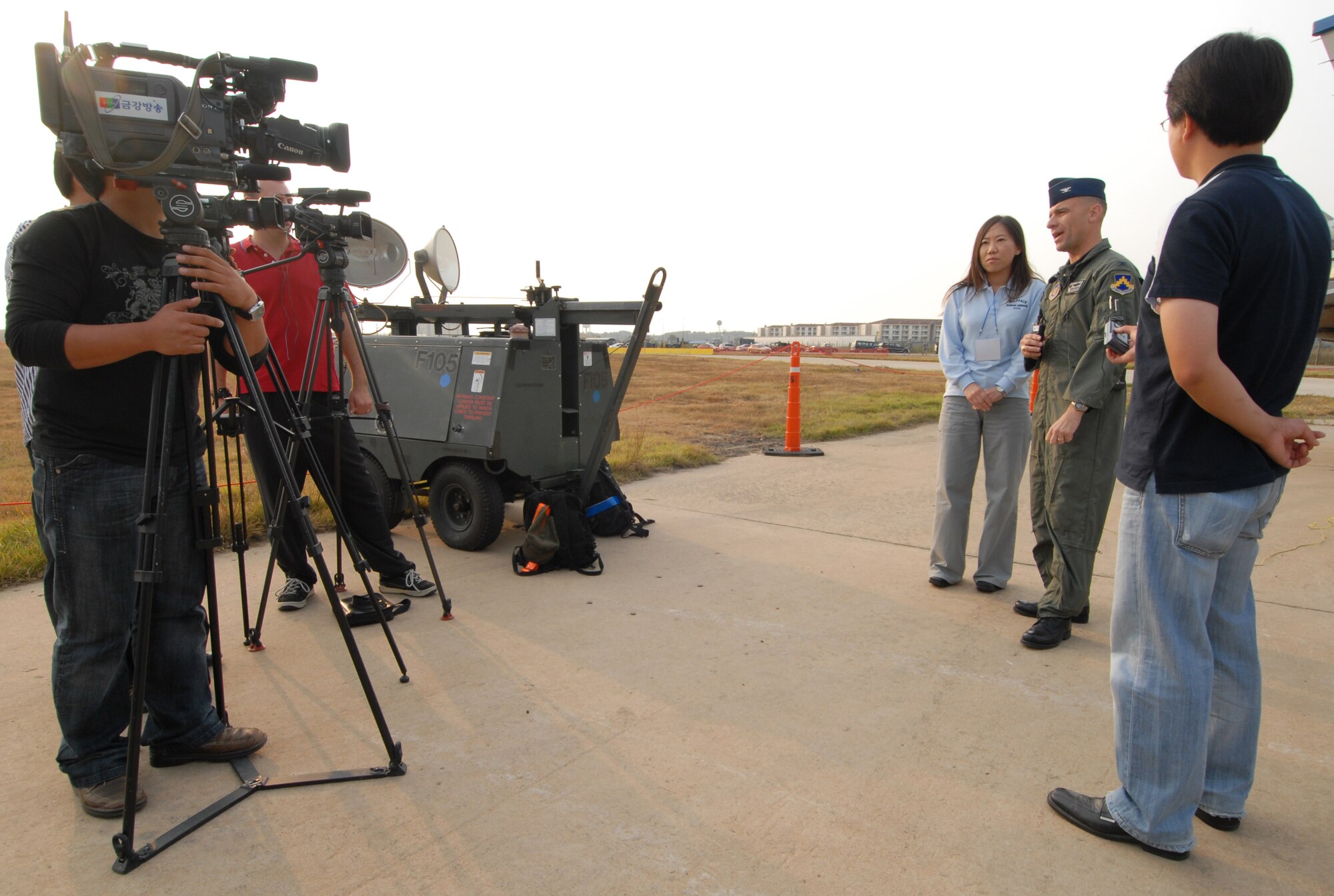 KUNSAN AIR BASE, Republic of Korea -- Col. Bryan "Wolf" Bearden, 8th Fighter Wing Commander, speaks to a Korean reporter during the 2008 Gunsan Airshow here, Oct. 4. The City of Gunsan, 8th Fighter Wing and Republic of Korea Air Forces' 38th Fighter Group hosted the first ever partnership Air Show in Gunsan, Oct. 4-5. (U.S. Air Force photo/Senior Airman Gustavo Gonzalez)