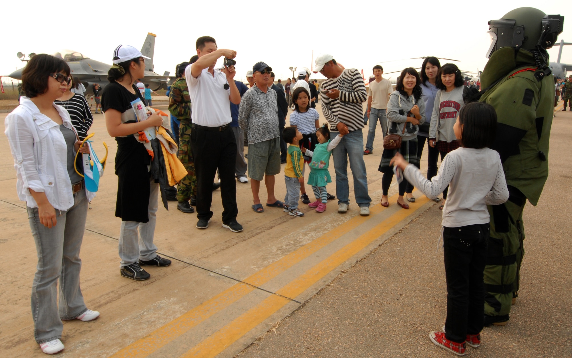 KUNSAN AIR BASE, Republic of Korea -- Members of the 8th Civil Engineer Squadron Explosive Ordinance Disposal team, demonstrate the explosive ordinance disposal bomb suit during the 2008 Gunsan Air Show here, Oct. 4. The City of Gunsan, 8th Fighter Wing and Republic of Korea Air Forces' 38th Fighter Group hosted the first ever partnership Air Show in Gunsan, Oct. 4-5. (U.S. Air Force photo/Senior Airman Gustavo Gonzalez)