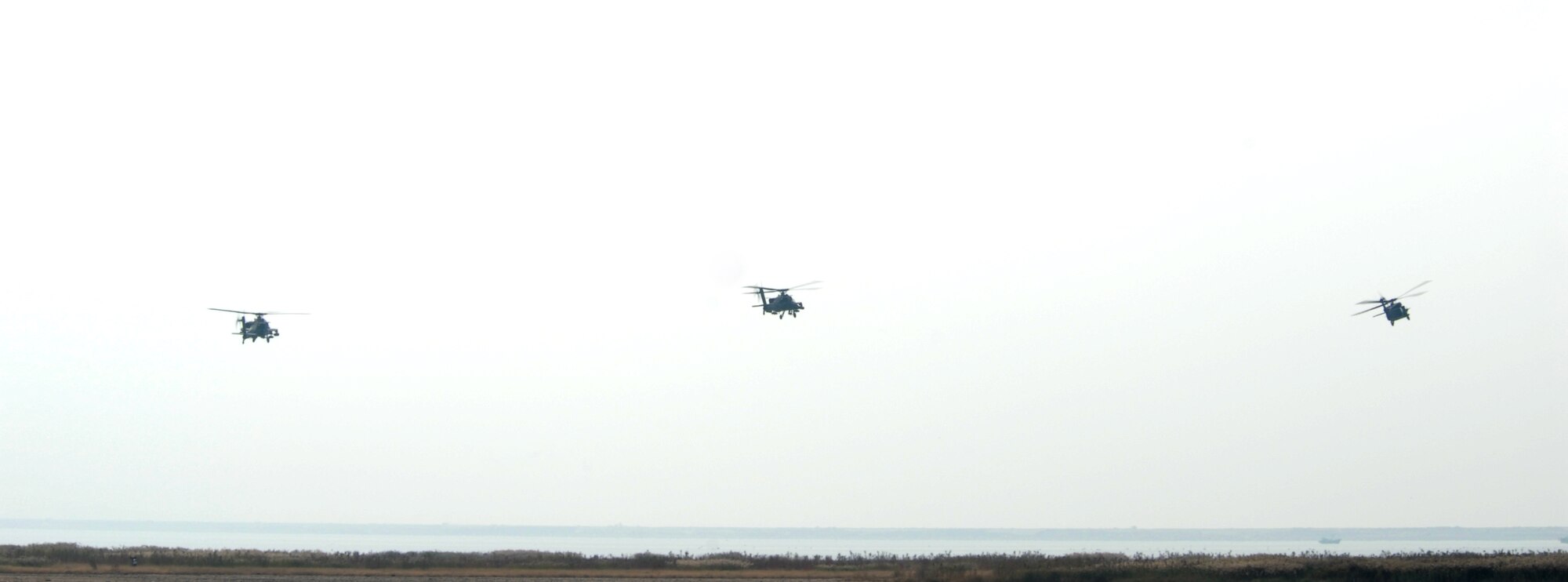 KUNSAN AIR BASE, Republic Of Korea -- Two AH-64 Apache and a HH-60 Pave Hawk fly for an aerial demonstration during the Gunsan partnership Air show here, Oct. 5.The City of Gunsan, 8th Fighter Wing and Republic of Korea Air Forces’ 38th Fighter Group hosted the first ever partnership Air Show in Gunsan, Oct. 4-5.(U.S. Air Force photo by: Senior Airman Angela Ruiz) 