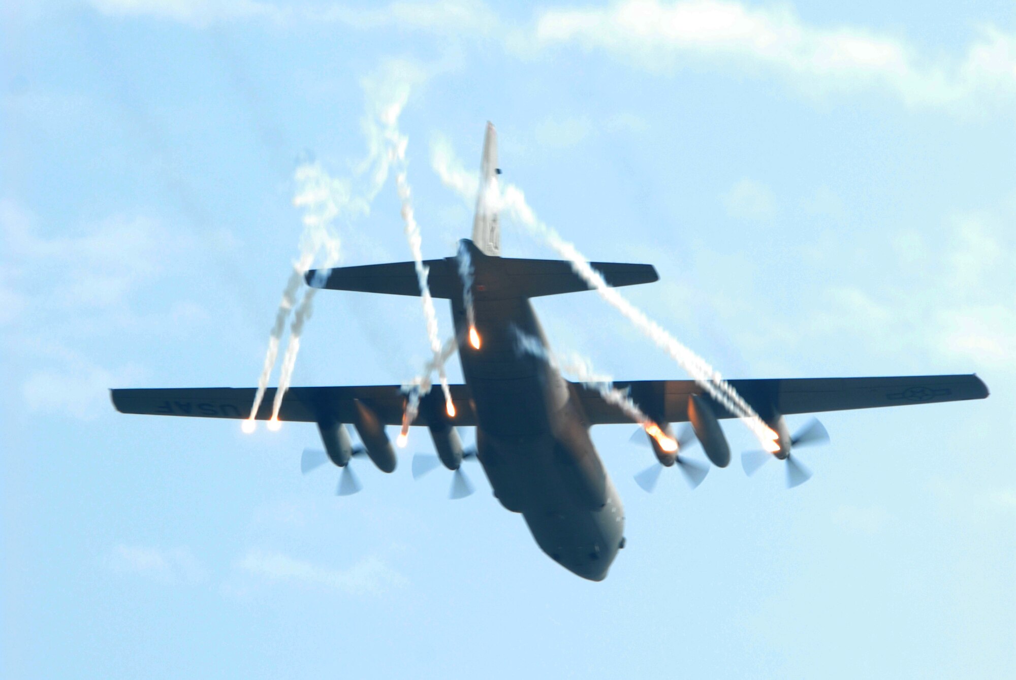KUNSAN AIR BASE, Republic Of Korea -- A C-130 from Yokota Air Base, Japan, releases flares during the Gunsan partnership Air show here, Oct 5.The City of Gunsan, 8th Fighter Wing and Republic of Korea Air Forces’ 38th Fighter Group hosted the first ever partnership Air Show in Gunsan, Oct. 4-5.(U.S. Air Force photo by: Senior Airman Angela Ruiz)