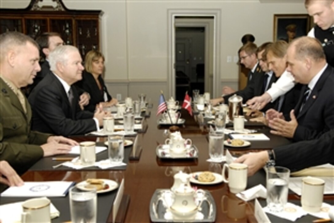 U.S. Defense Secretary Robert M. Gates, second from left, Vice Chairman of the Joint Chiefs of Staff Marine Gen. James E. Cartwright, far left, and Danish Minister of Defense Soren Gade, right, talk during a luncheon at the Pentagon, Oct. 6, 2008.