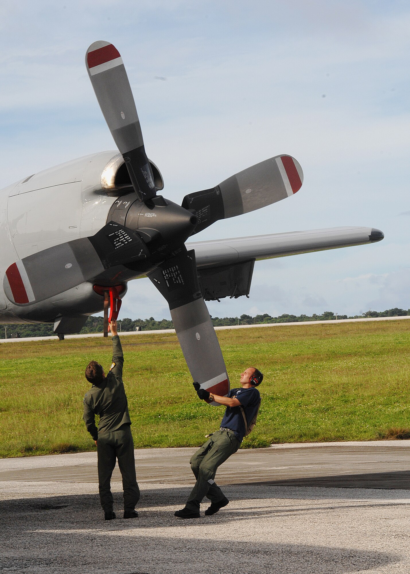 ANDERSEN AIR FORCE BASE, Guam - Royal New Zealand air force members perform a post-flight safety inspection on the P-3K Orion here Oct. 7. Safety inspections are conducted after each flight to determine if any maintenance work is needed on the aircraft. The Royal New Zealand air force members are here to participate in "Operation Island Chief,” a joint exercise with the U.S Navy and U.S. Coast Guard. (U.S. Air Force photo by Airman 1st Class Nichelle Griffiths)