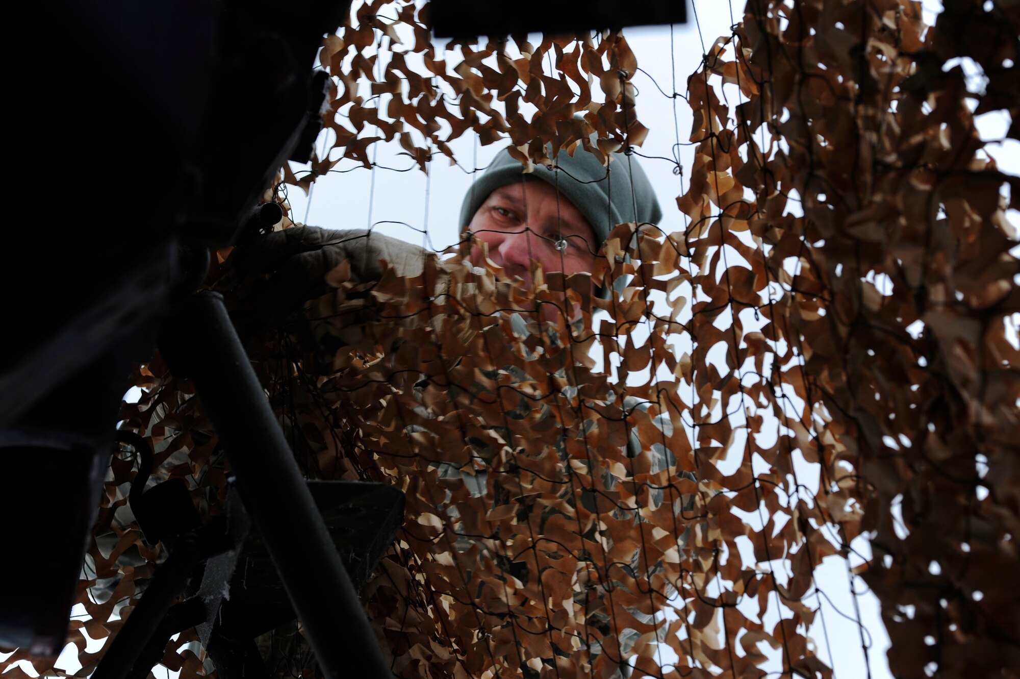 Tech. Sgt. Frank Deans, 353rd Combat Training Squadron, ties down radar scattering camo netting to a Russian P-15 flat face radar truck during RED FLAG-Alaska 09-1 Oct. 6, 2008, at Eielson Air Force Base, Alaska. The netting contains fibers of stainless steel which blocks the passage, reflection, and return of a threat radar signal.  (U.S. Air Force photo/Airman 1st Class Jonathan Snyder)