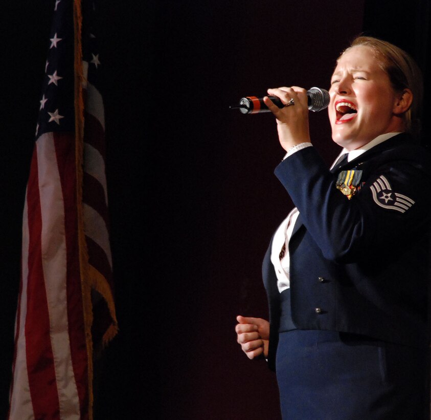 LAUGHLIN AIR FORCE BASE, Texas – Staff Sgt. Mary Beth McFann, vocalist, sings while The Band of the West performs behind her at the Paul Poag Theatre here Oct. 2. (U.S. Air Force photo by Airman 1st Class Sara Csurilla)