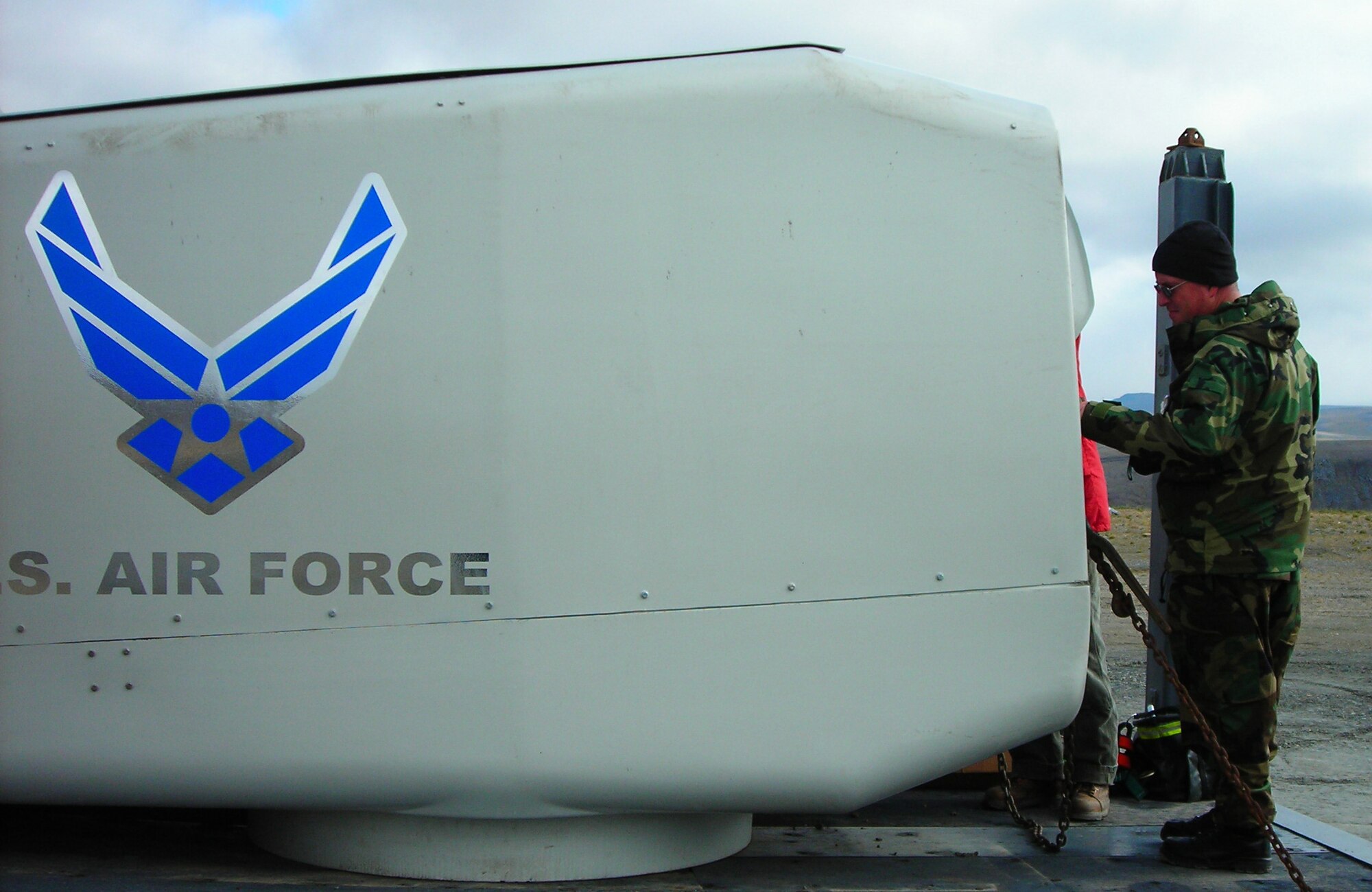 TIN CITY LONG RANGE RADAR STATION, Alaska - Master Sgt. James Fraser, 611th Civil Engineer Squadron, non-commissioned officer in charge of quality assurance, inspects the turbine nacelle prior to it being installed at the top of the tower.        