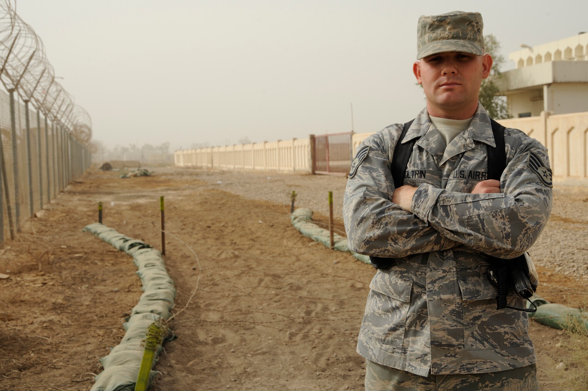 AL TAJI AIR BASE, Iraq -- U.S. Air Force Staff Sgt. Matthew Coltrin, a military training instructor air advisor with the 370th Expeditionary Training Squadron, poses for a photo at the Iraqi basic military training tactical course. Coltrin, a Lake Charles, La. native, is deployed from the 322nd Training Squadron, Lackland Air Force Base, Texas. (U.S. Air Force photo/Staff Sgt. Paul Villanueva II)