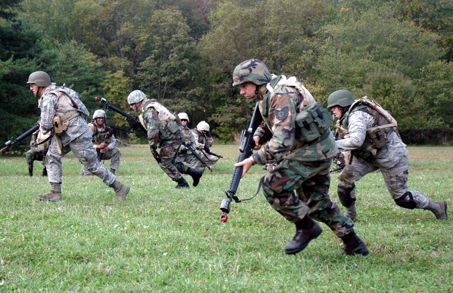 Students from the Advanced Contingency Skills Training Course 09-1 practice their 'rush-and-roll' techniques during their basic field tactics training on a Fort Dix, N.J. range Oct 4, 2008.  ACST is taught by the U.S. Air Force Expeditionary Center's 421st Combat Training Squadron at Fort Dix and in fiscal 2008 prepared more than 1,500 Airmen for deployments. (U.S. Air Force Photo/Staff Sgt. Paul R. Evans)