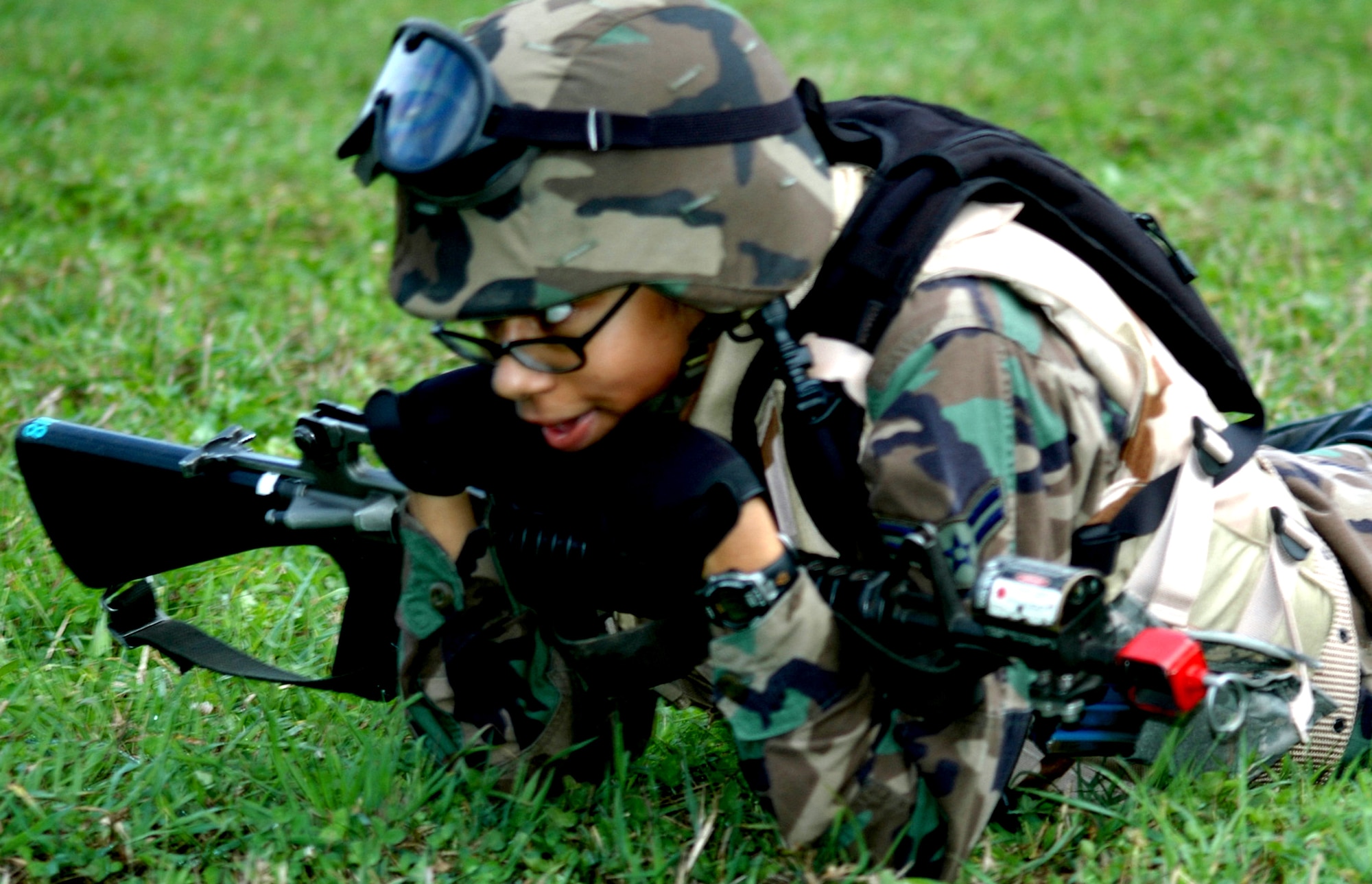 Airman 1st Class Jacinta Puryear, from Scott Air Force Base, Ill., crawls during tactics training in the Advanced Contingency Skills Training Course 09-1 on a Fort Dix, N.J., range Oct 4, 2008.  ACST is taught by the U.S. Air Force Expeditionary Center's 421st Combat Training Squadron at Fort Dix and in fiscal 2008 prepared more than 1,500 Airmen for deployments. (U.S. Air Force Photo/Staff Sgt. Paul R. Evans)