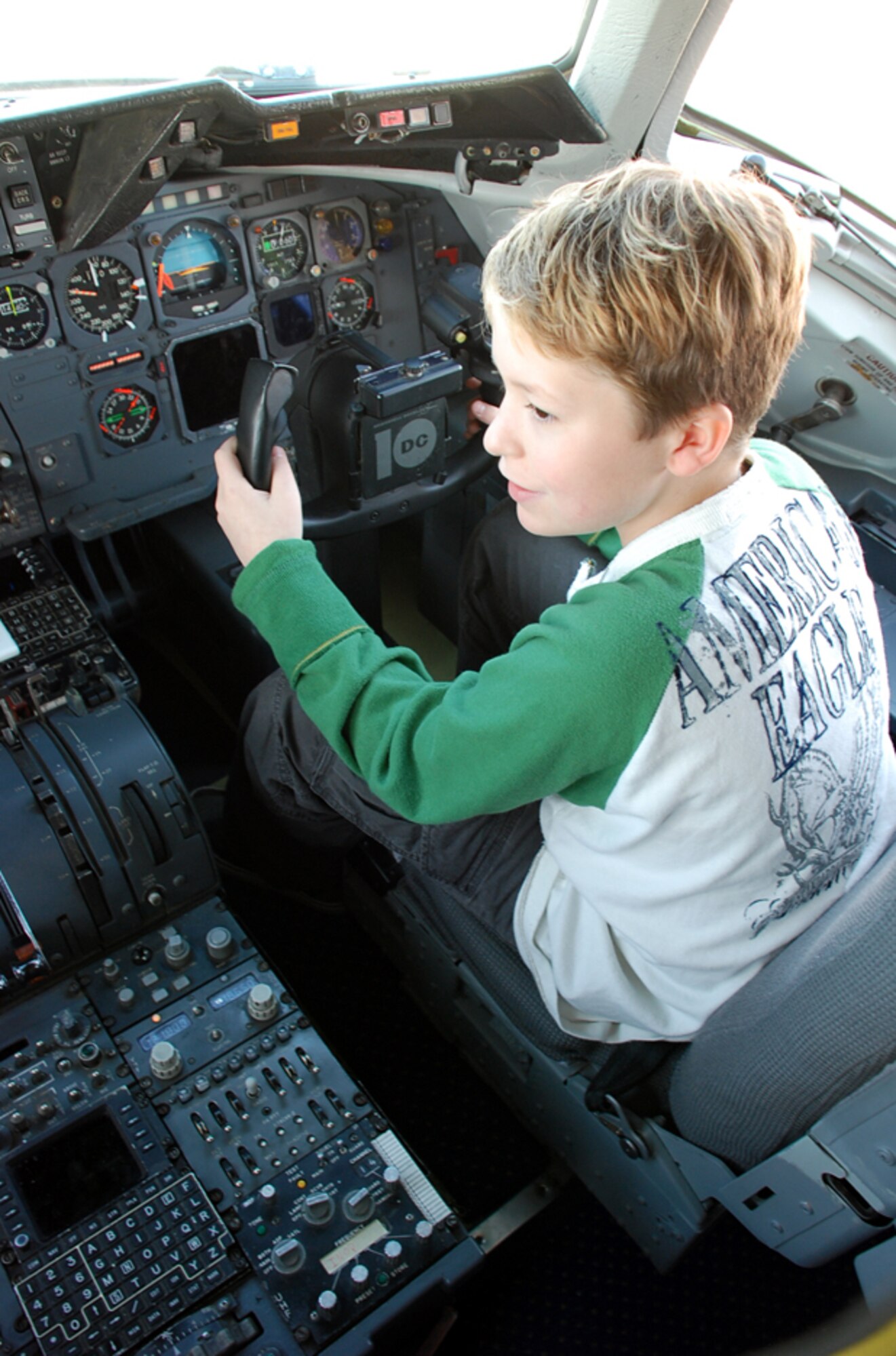 Nicholas Whiting, 11, a sixth grader from North Hanover Township UES, enjoys time in a KC-10 cockpit on McGuire’s flightline Oct. 3. Nicholas and other children from his school participated in a Kids Deployment Line and “deployed” to Camp Camel, Saudi Arabia. (U.S. Air Force photo/Airman 1st Class Bekah Phy)