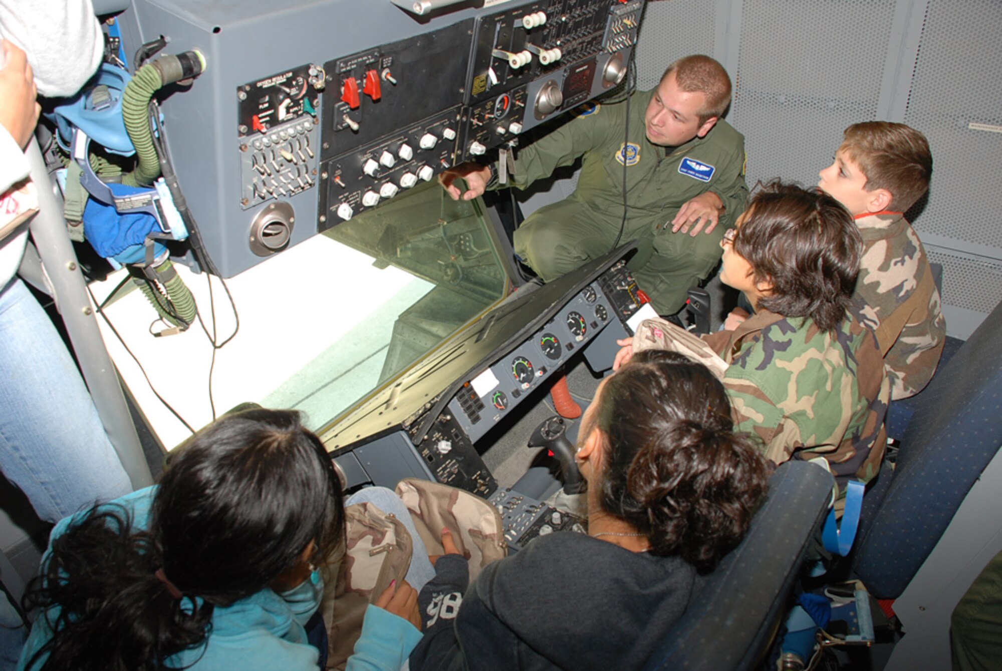 Staff Sgt. Chris Hagstrom, 32nd Air Refueling Squadron boom operator, shows children from North Hanover Township UES the mechanics of a boom. The children participated in a Kids Deployment Line prior to their “deployment” to Saudi Arabia. The children also enjoyed a tour of the KC-10 cockpit before having a flight meal. (U.S. Air Force photo/Airman 1st Class Bekah Phy)