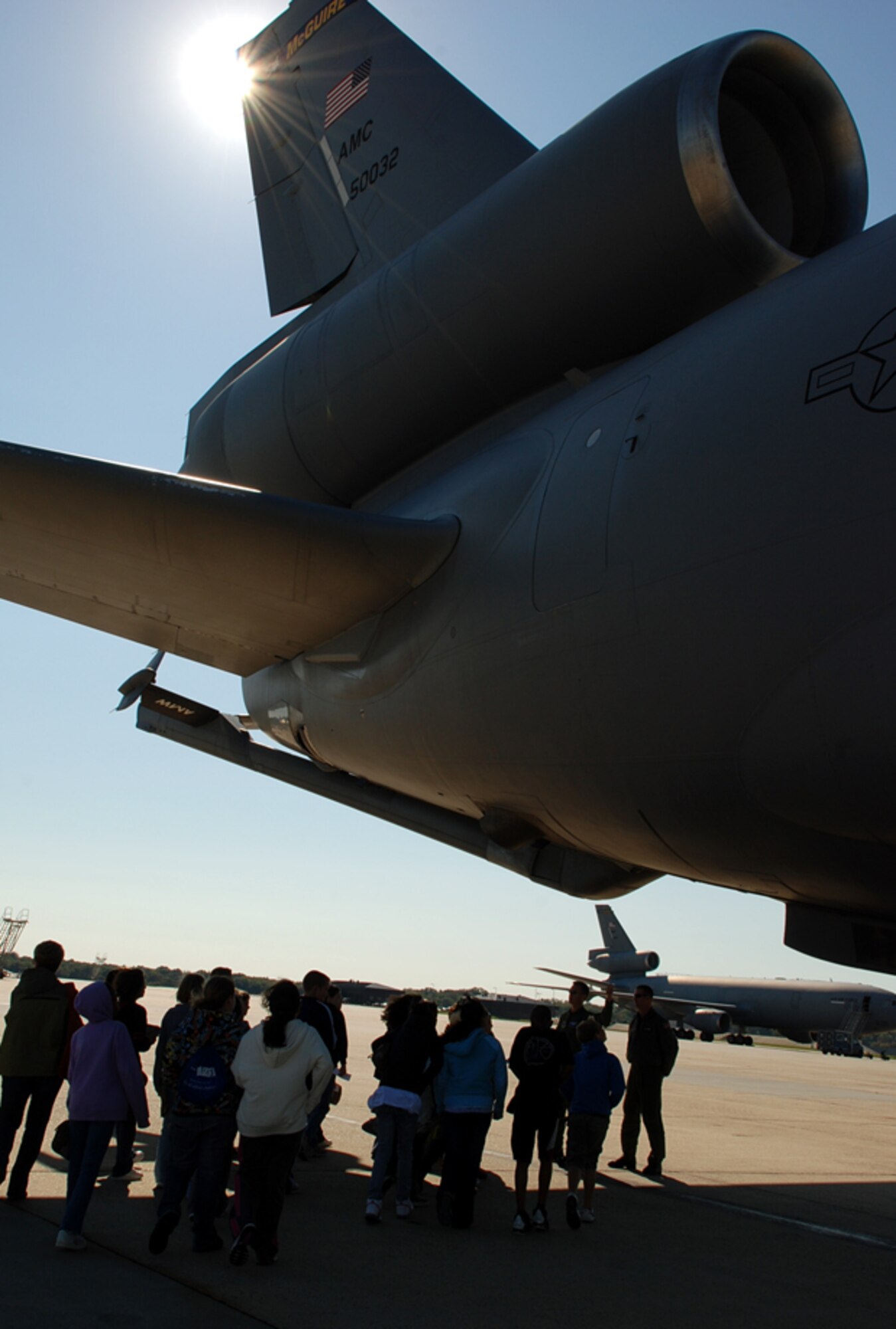 Members from the 6th Airlift Squadron conduct a tour for children outside of a KC-10 on McGuire’s flightline Oct. 3. The sixth graders from North Hanover Township UES participated in a Kids Deployment Line and “deployed” to Saudi Arabia. With a large percentage of military children at the school, the program is aimed to make children more aware of what their parents and other families go through during real-world deployments. (U.S. Air Force photo/Airman 1st Class Bekah Phy)