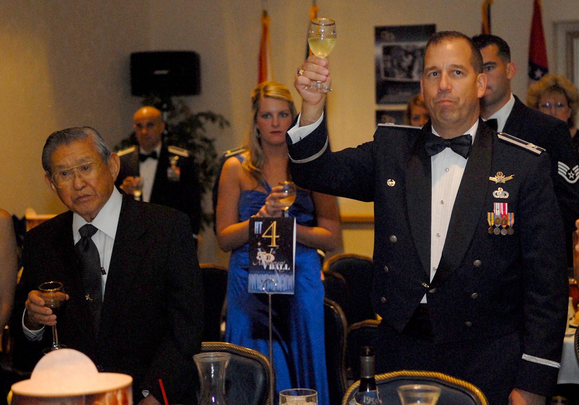 VANDENBERG AIR FORCE BASE, Calif. --  Col. Carl Frushon, commander of the 30th Launch Group, proposes a toast during Vandenberg's 50th Anniversary Ball on Oct. 4 at the Pacific Coast Club. During the dinner portion of the ball, a series of toasts are made, including one to prisoners of war and those servicemembers missing in action. The ball included a presentation of 50 years of Vandenberg history, as well as a speech by Gen. (Retired) Lance Lord, the former Air Force Space Command commander. (U.S. Air Force photo / Airman 1st Class Ashley Reed)