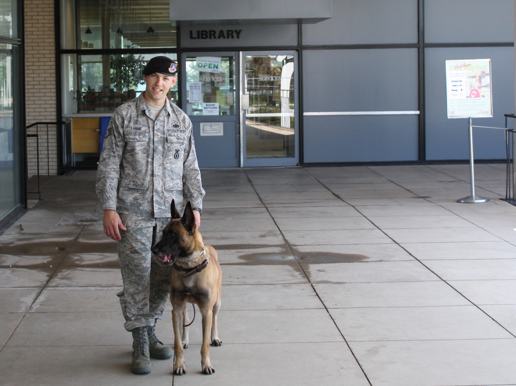 U.S. AIR FORCE ACADEMY, Colo. -- Staff Sgt. Kurt Lugar and military working dog, Dino, finished in third place at their first competition at the Rocky Mountain K9 Trails Sept. 21-22. (U.S. Air Force photo)