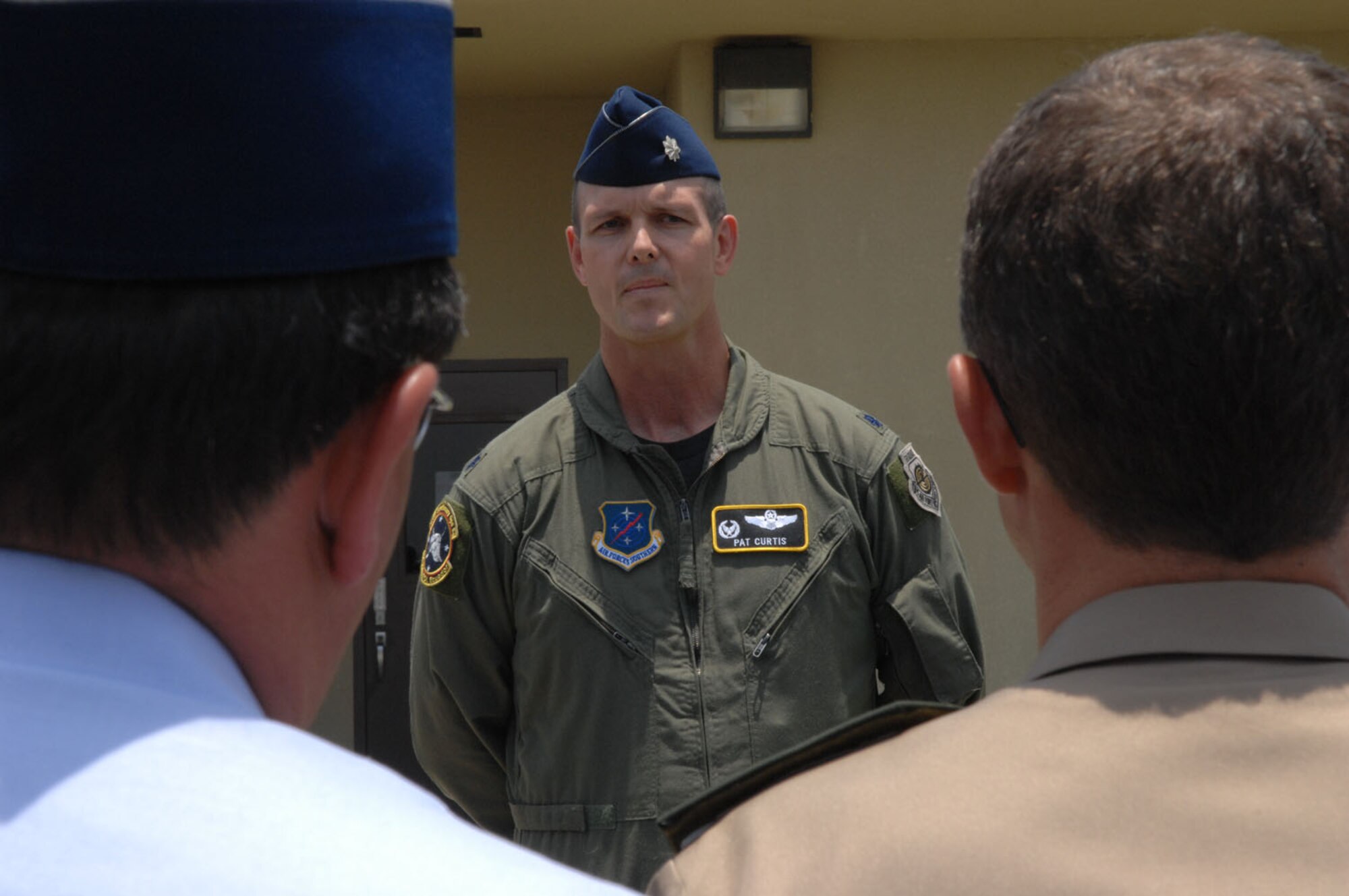 Lt. Col. Jared Patrick Curtis, 478th Expeditionary Operations Squadron commander, welcomes approximately 20 attaches and instructors to here October 3. The servicemembers represented 10 militaries throughout the world. (US Air Force photo/1Lt. Lauren Wright)