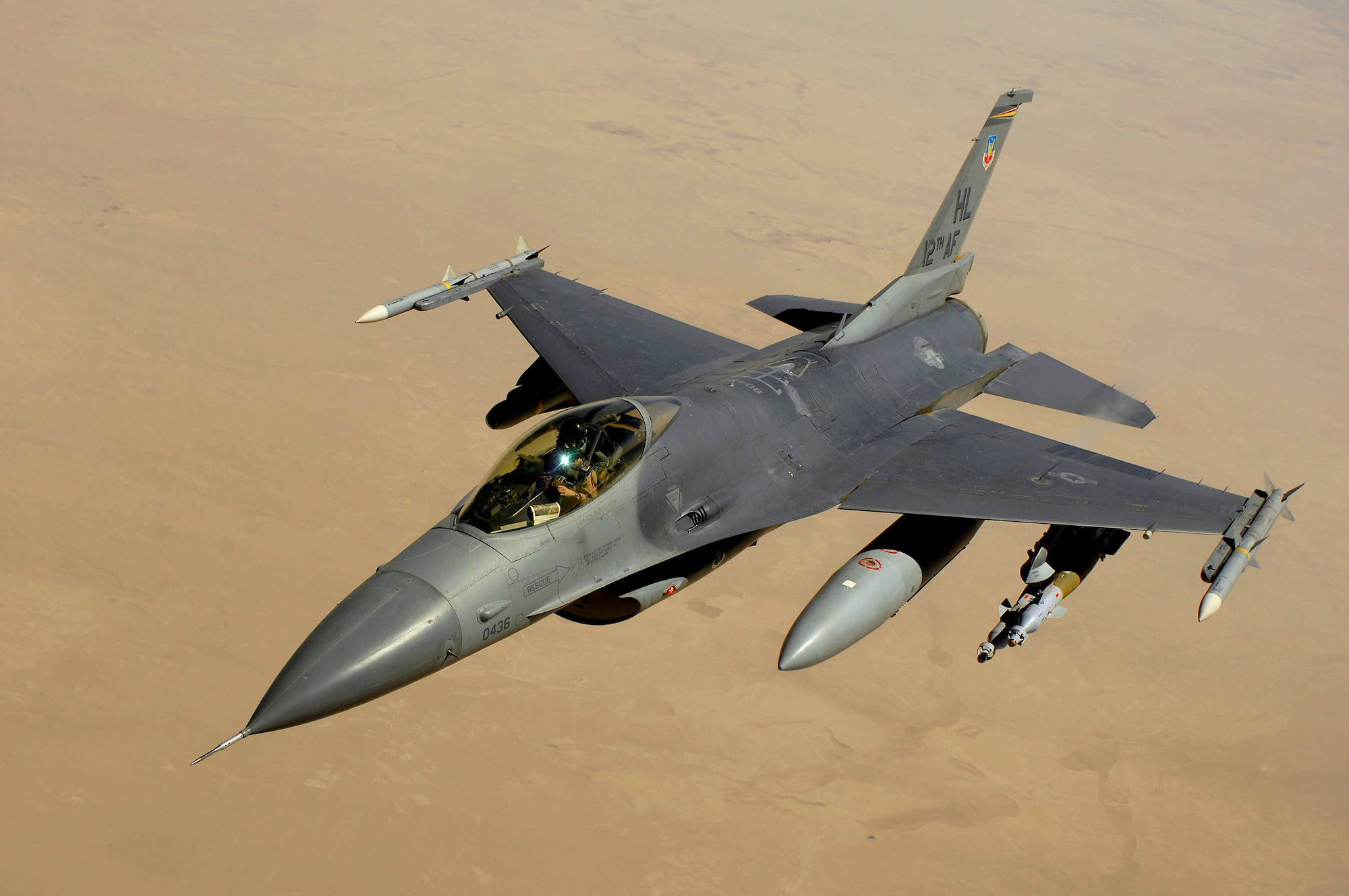 An F-16 Fighting Falcon aircraft returns to the fight after receiving fuel from a KC-135 Stratotanker during a mission over Iraq. The F-16 is a compact, multirole fighter aircraft with high maneuverability. (U.S. Air Force photo/Master Sgt. Andy Dunaway) 