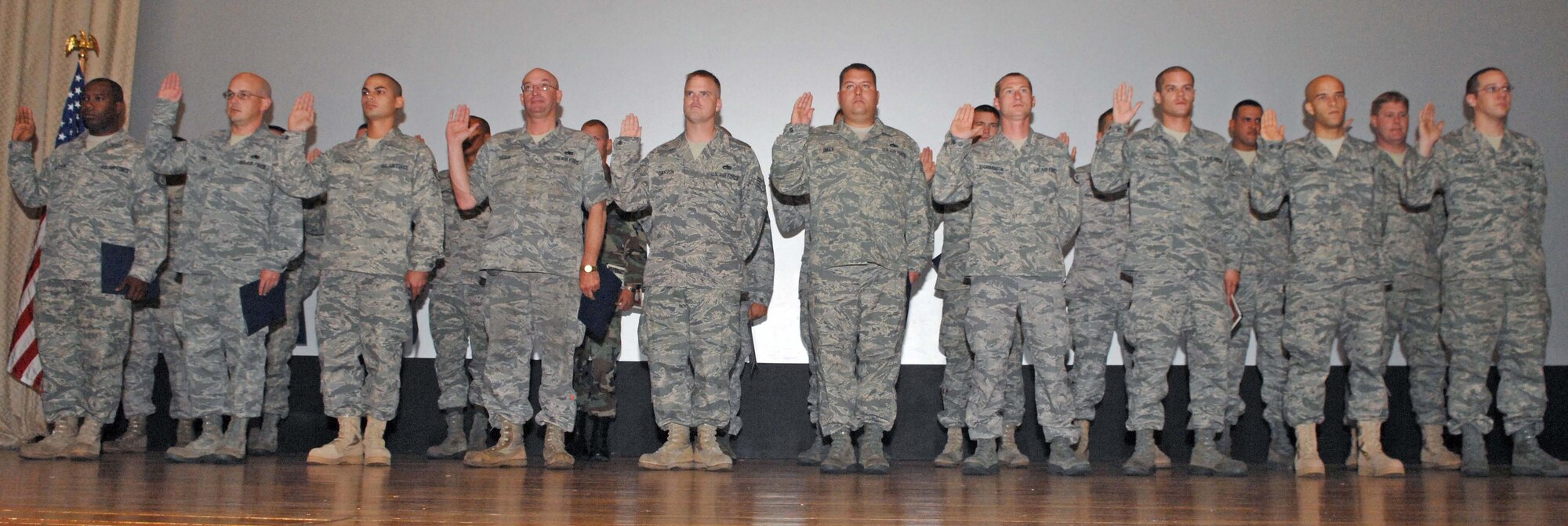 DYESS AIR FORCE BASE, Texas -- Dyess’ 317th Aircraft Maintenance Squadron crew chiefs swear by the mechanic’s creed during an induction ceremony Oct. 6 at the base theater. During the Dedicated Crew Chief assignment ceremony, crew chiefs were each assigned a C-130 Hercules that would be theirs to maintain. In order to be chosen as a DCC, a maintainer must have at least six months of experience working on their specific aircraft and hold the rank of staff sergeant or above. (U.S. Air Force photo/Staff Sgt. Connor Estes)