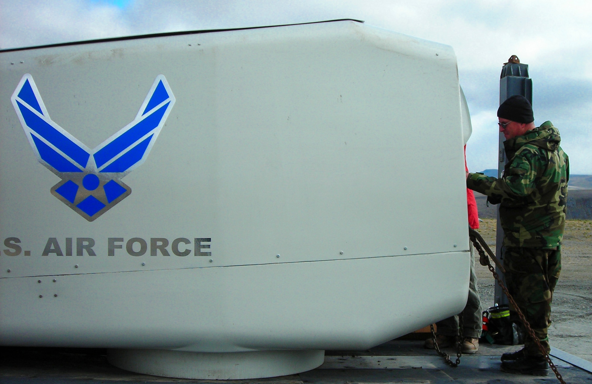 TIN CITY LRRS, Alaska -- Master Sgt. James Fraser, 611th Civil Engineer Squadron quality assurance NCO in-charge, inspects the turbine nacelle prior to it being installed at the top of the tower. (U.S. Air Force photo)