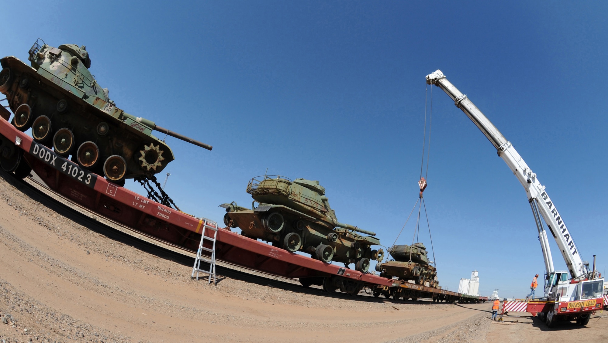 CANNON AIR FORCE BASE, N.M.-- Work crews unload a decommissioned M60 tank that arrived at Clovis Oct. 1 from Anniston Army Depot, Ala. The tanks will be used as targets on Melrose Air Force Range. (U.S. Air Force photo by Airman Maynelinne De La Cruz) 