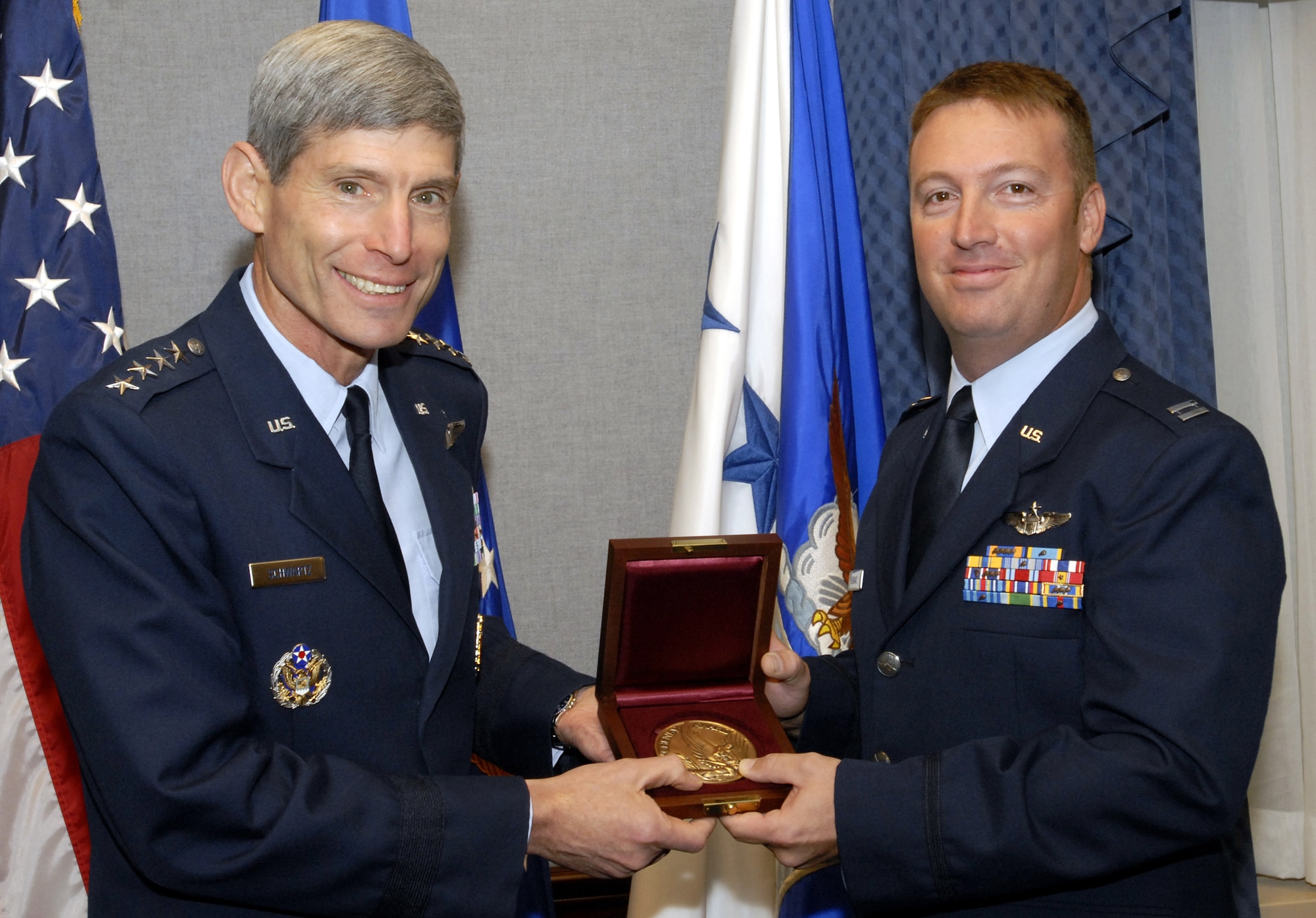 Air Force Chief of Staff Gen. Norton Schwartz presents Capt. Chad Bubanas with the Cheney Award Oct. 6 at the Pentagon. Captain Bubanas received the award for his actions as the aircraft commander of an AC-130H Spectre gunship providing close-air support to troops on the ground in Afghanistan in May 2007. The Cheney Award is presented each year to aviators who demonstrate an act of valor, extreme fortitude or self-sacrifice in a humanitarian venture. Captain Bubanas, an Aurora, Colo., native, is assigned to the 18th Flight Test Squadron, Hurlburt Field, Fla. (U.S. Air Force photo)
