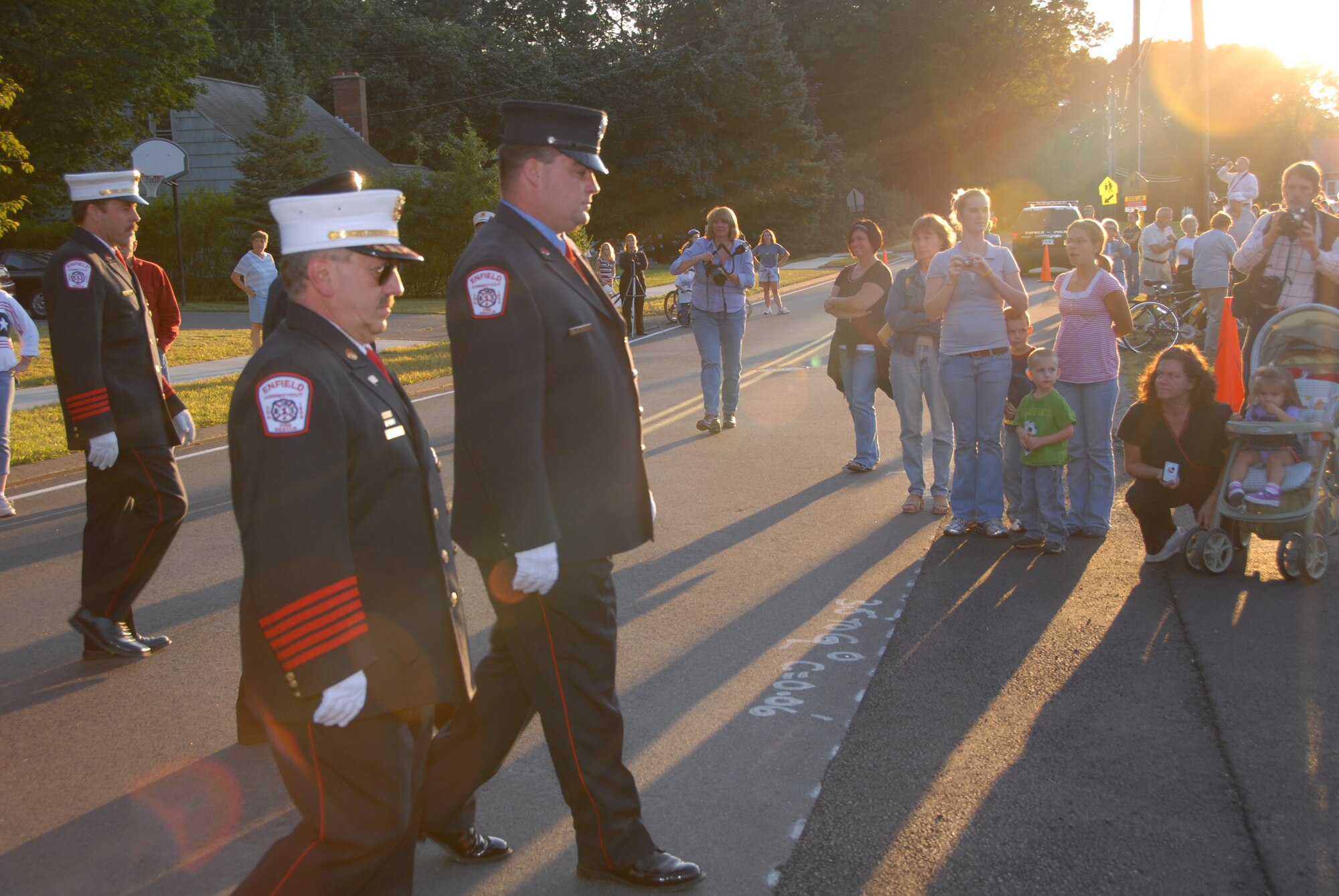 Senior Airman Brian Ellis, a fire fighter with the 103rd Civil Engineer Squadron and a member of the Enfield Fire Department, marches in the 9-11 Memorial Parade in  Enfield, Conn. on September 11, 2008. (U.S. Air Force Photo by Senior Airman Kerry P. Carbonell)
