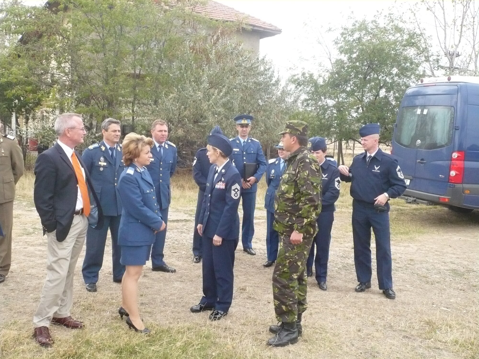 Chief Master Sgt. Pamela Derrow, USAFE command chief, (center) and three other Ramstein senior noncommissioned officers visit with Romanian Air Force senior enlisted leaders at the Boboc Training Center, Romania, Sep. 22-27 as part of an ongoing USAFE theater security cooperation engagement. The U.S. Air Force senior NCOs familiarized themselves with Romanian enlisted development, education and technical training, and senior NCO and NCO academy organizational structure, roles and mission. (Courtesy photo)