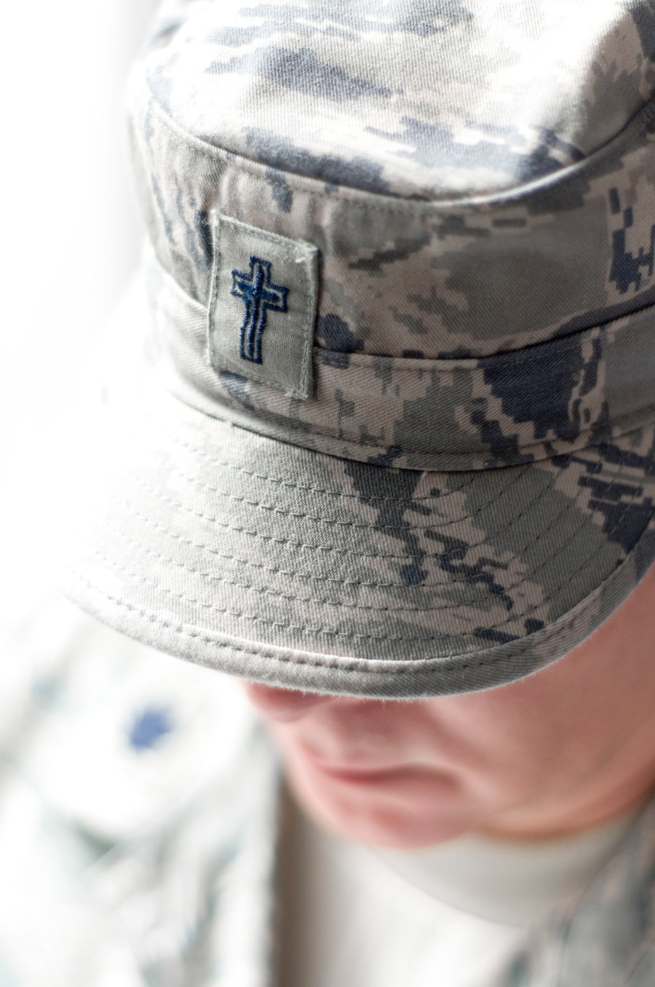 BAGRAM AIR FIELD, Afghanistan -- The Holy Cross adorning the patrol cap signifies non-combatant status and responsibility of a chaplain. Air Force chaplains are charged with the spiritual welfare of their Airmen. In a largely Islamic deployed environment where stress is high, that charge does not change. Chaplains assigned to the 455th Air Expeditionary Wing work hard to ensure that their Airmen are spiritually "fit to fight." (U.S. Air Force photo by Staff Sgt. Samuel Morse/Released)