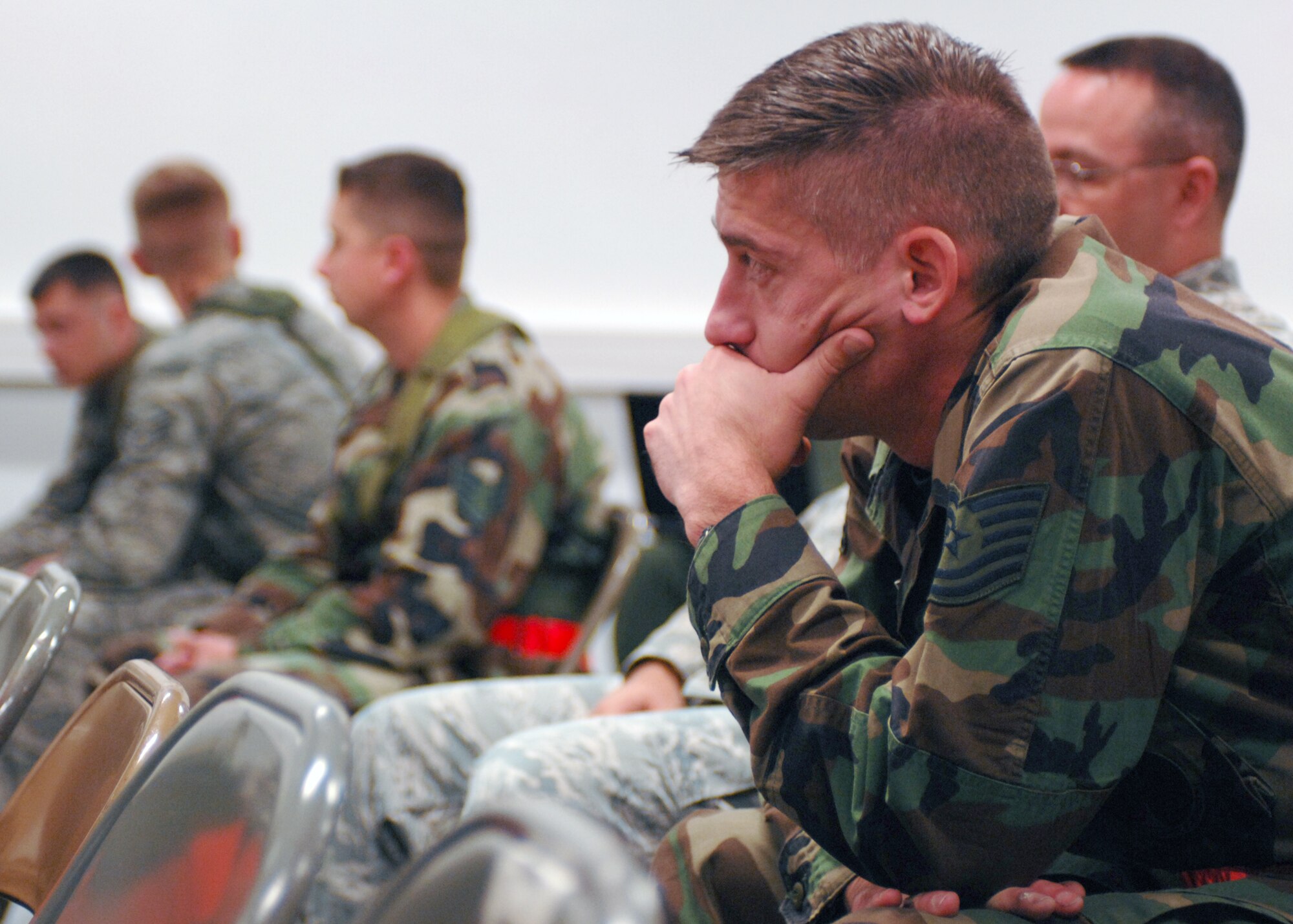 SPANGDAHLEM AIR BASE, Germany -- Tech. Sgt. Samuel Okroi, 52nd Equipment Maintenance Squadron, waits for a briefing during the Personnel Deployment Function portion of the Phase I exercise at Spangdahlem Air Base on Sept. 29, 2008. Spangdahlem AB conducted a base-wide exercise to test the readiness of personnel for deployment. (U.S. Air Force photo by Airman 1st Class Nathanael Callon)