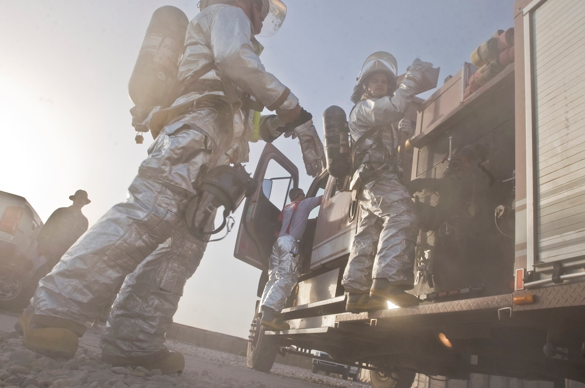 ALI BASE, Iraq -- 407th Expeditionary Civil Engineer Squadron fire fighters respond to a training exercise Oct. 3, 2008. The structural drill was performed at the passenger terminal to evaluate every aspect of fire protection, from dispatch to the actual response itself. (U.S. Air Force photo/Airman 1st Class Christopher Griffin)