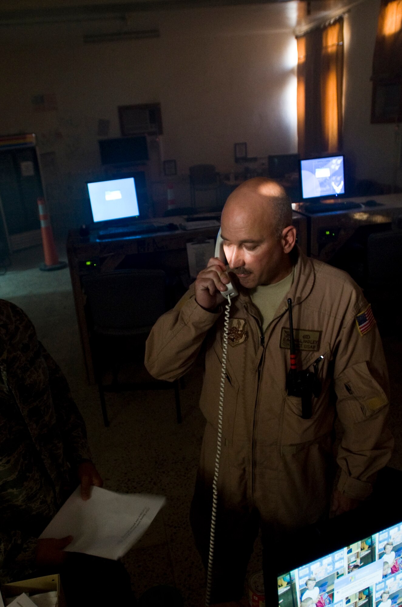ALI BASE, Iraq ? Master Sgt. William Hadley Jr., 407th Expeditionary Civil Engineer Squadron assistant chief of training, calls in a simulated fire at the passenger terminal Oct. 3, 2008. The 407th ECES fire department contains Airmen from several different bases. It held a structural drill to evaluate how the unit would respond to a fire alert. Hadley is deployed from Eglin Air Force Base, Fla. (U.S. Air Force photo/Airman 1st Class Christopher Griffin)