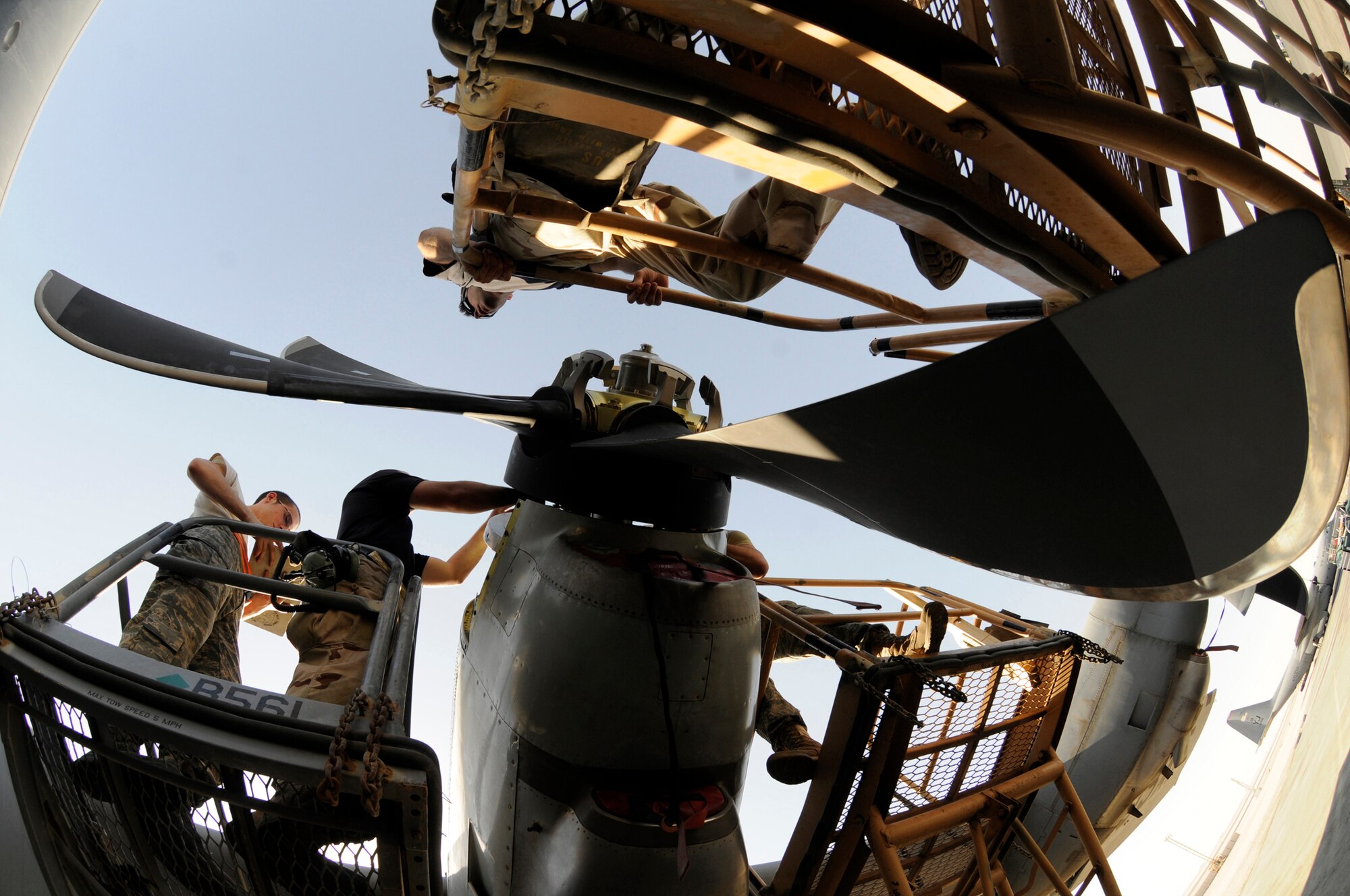 Members of the 379th Expeditionary Aircraft Maintenance Squadron change a C-130J propeller Oct. 6, 2008, at an undisclosed air base in Southwest Asia.  Maintainers assigned to the EAMXS ensure aircraft are ready to fly Global War on Terror missions.  The C-130 Hercules primarily performs the tactical portion of the airlift mission. The aircraft is capable of operating from rough, dirt strips and is the prime transport for air dropping troops and equipment into hostile areas in support of Operations Iraqi and Enduring Freedom and Joint Task Force-Horn of Africa.  (U.S. Air Force photo by Staff Sgt. Darnell T. Cannady/Released)