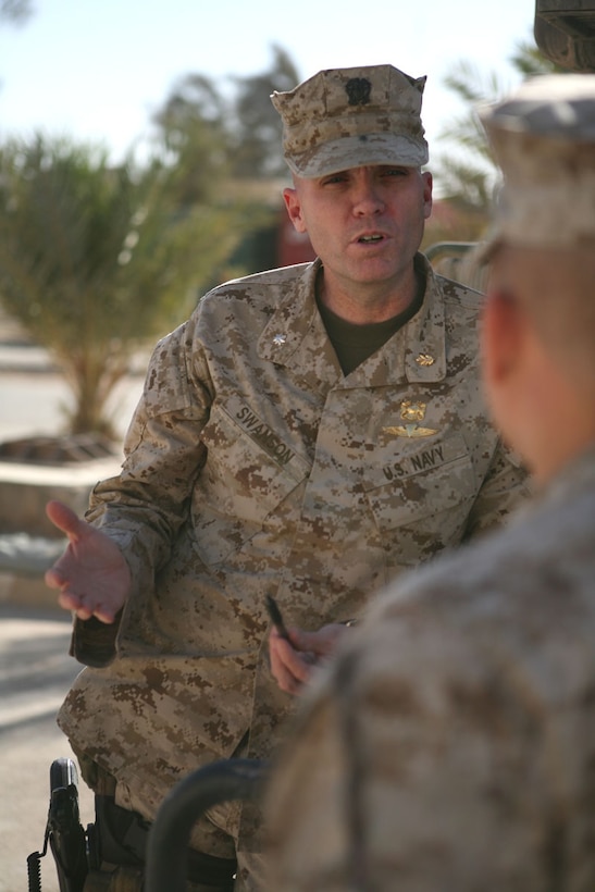 Navy Cmdr. (Dr.) Michael G. Swanson, Regimental Combat Team 5 regimental surgeon, discusses plans for an upcoming cooperative medical engagement with Navy Petty Officer 2nd Class Michael G. Bundeson, Oct. 2, 2008, at the Regimental Aid Station on Camp Ripper, Iraq. Marine Corps medicine has been instrumental in RCT 5's efforts to gain the trust of key Iraqi leaders, allowing more access to the population so civilian-military operations can be more successful. U.S. Marine Corps photo by Sgt. Trent M. Lowry, Regimental Combat Team 5
