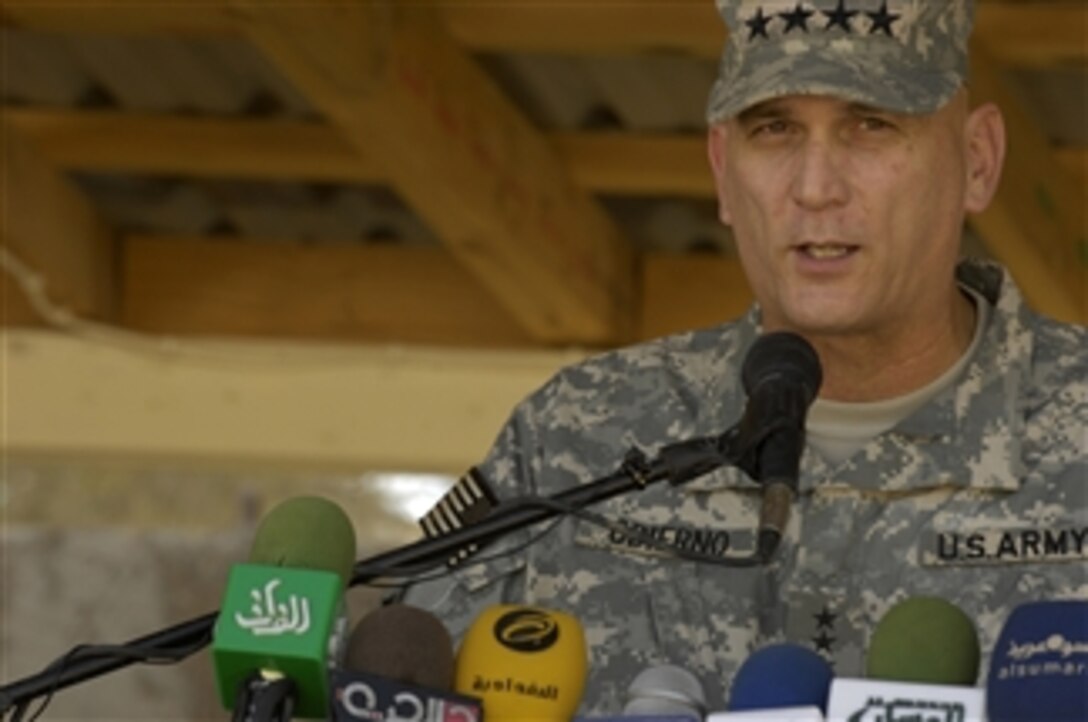 Commanding General of Multi-National Force-Iraq Gen. Raymond T. Odierno, U.S. Army, expresses his gratitude to Polish military forces during the end of mission ceremony for Polish command of Multinational Division Central - South at Camp Echo, Iraq, on Oct. 4, 2008.  
