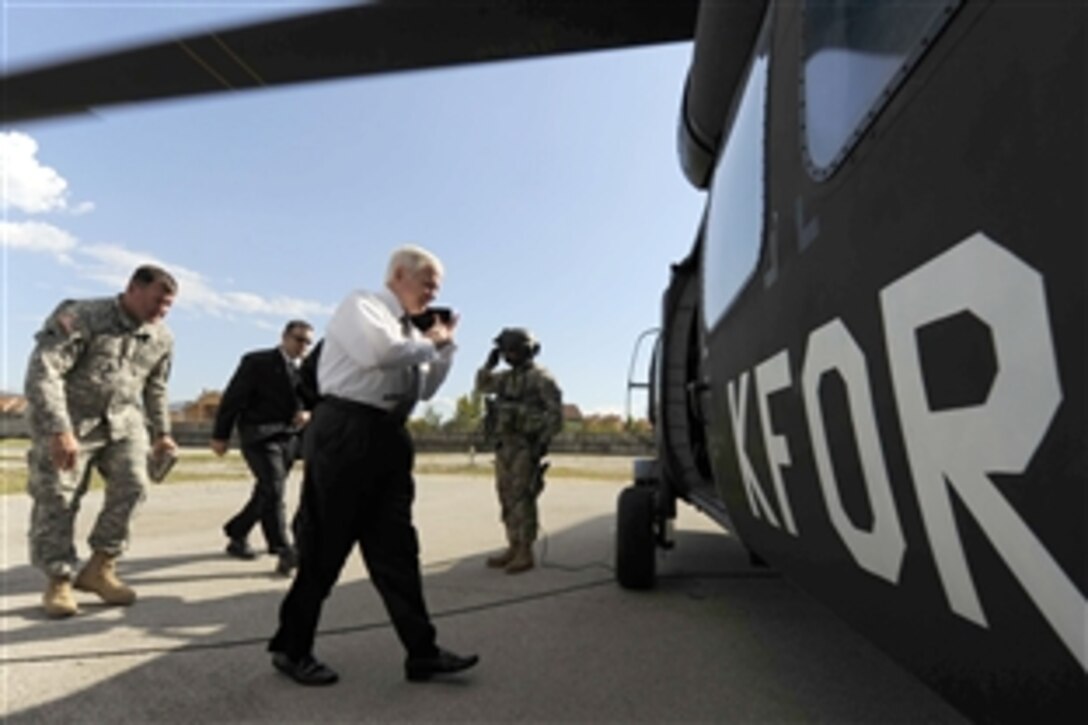 Defense Secretary Robert M. Gates boards a UH-60 Blackhawk on Camp Montieth, Kosovo, after touring the local town of Gjilan on foot, Oct. 7, 2008. 